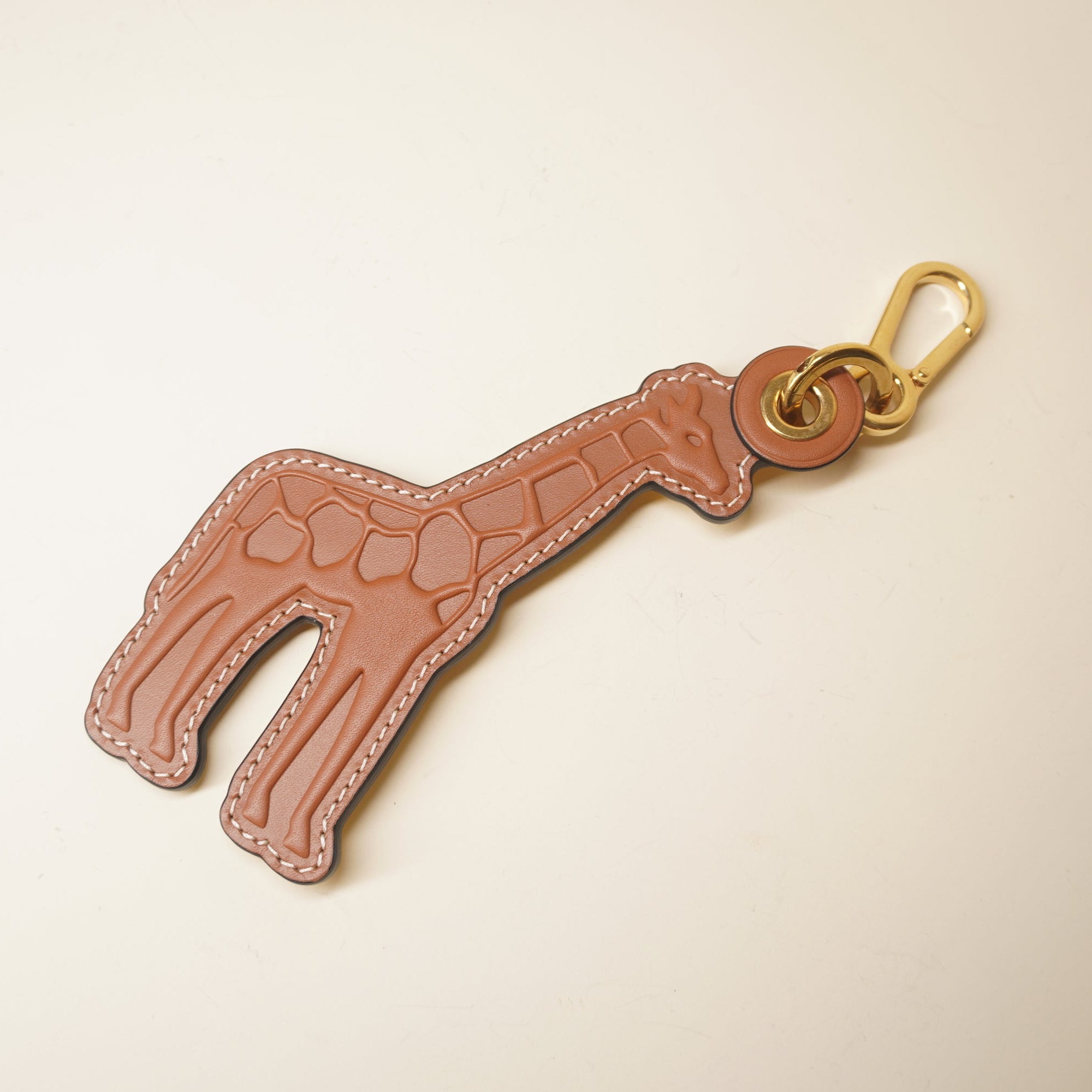 PRE-OWNED Giraffe leather brown bag charm