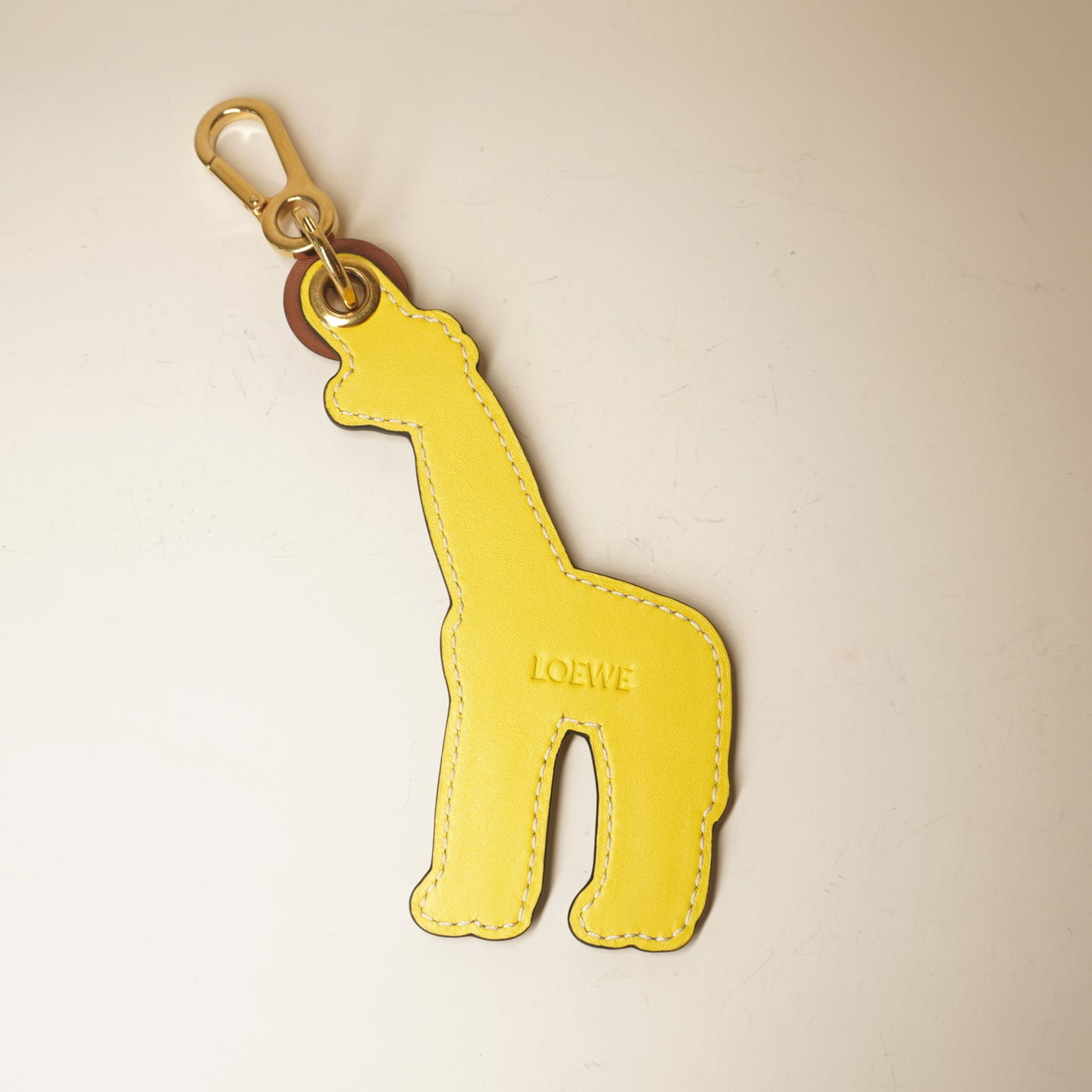 PRE-OWNED Giraffe leather brown bag charm