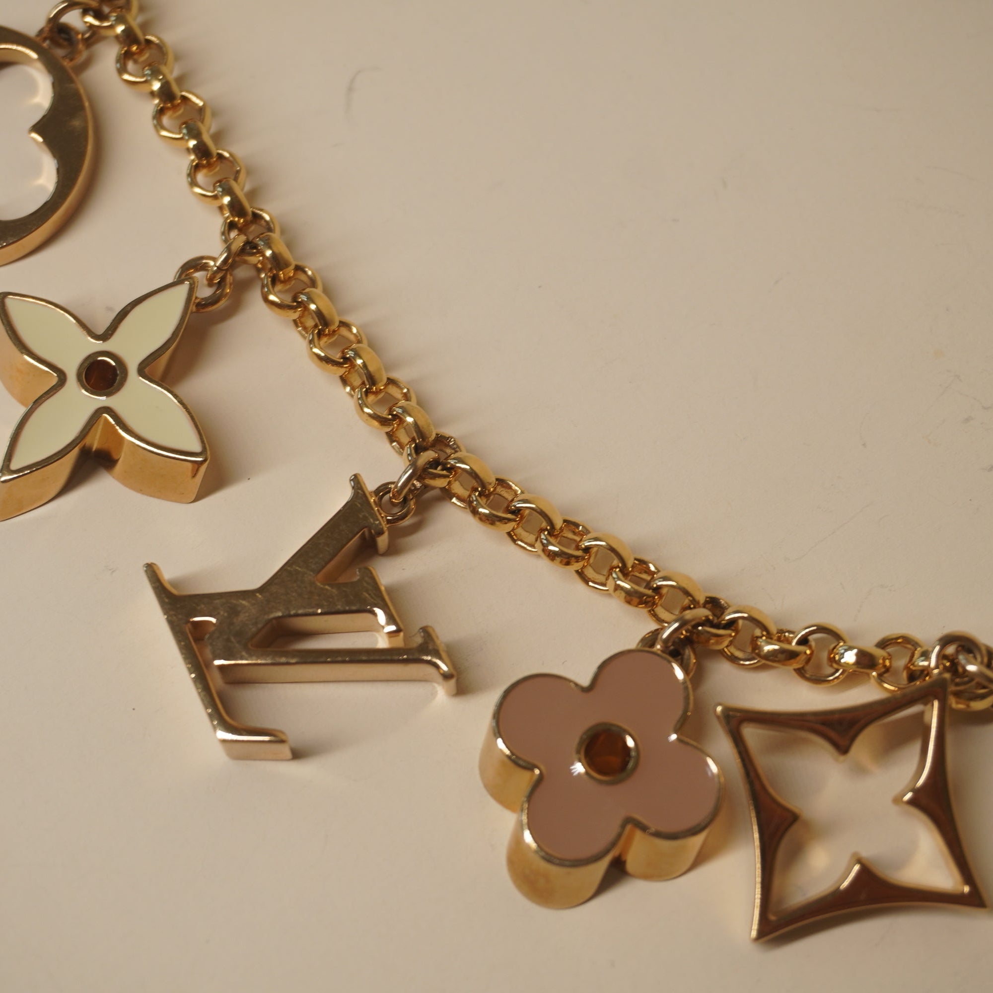 PRE-OWNED Brass Enamel Fleur De Monogram Bag Charm Chain
