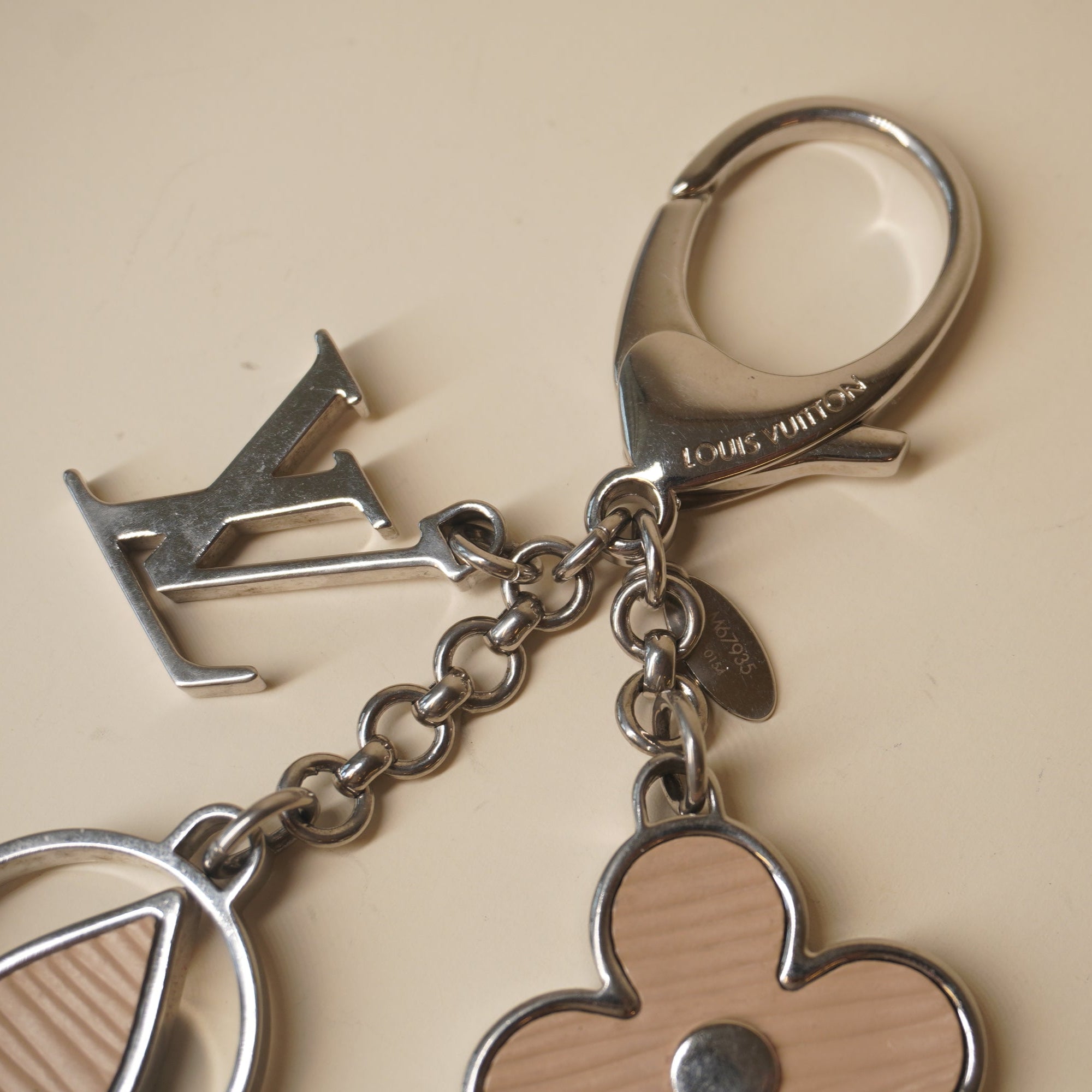 PRE-OWNED Epi Rimy Beige Bag Charm