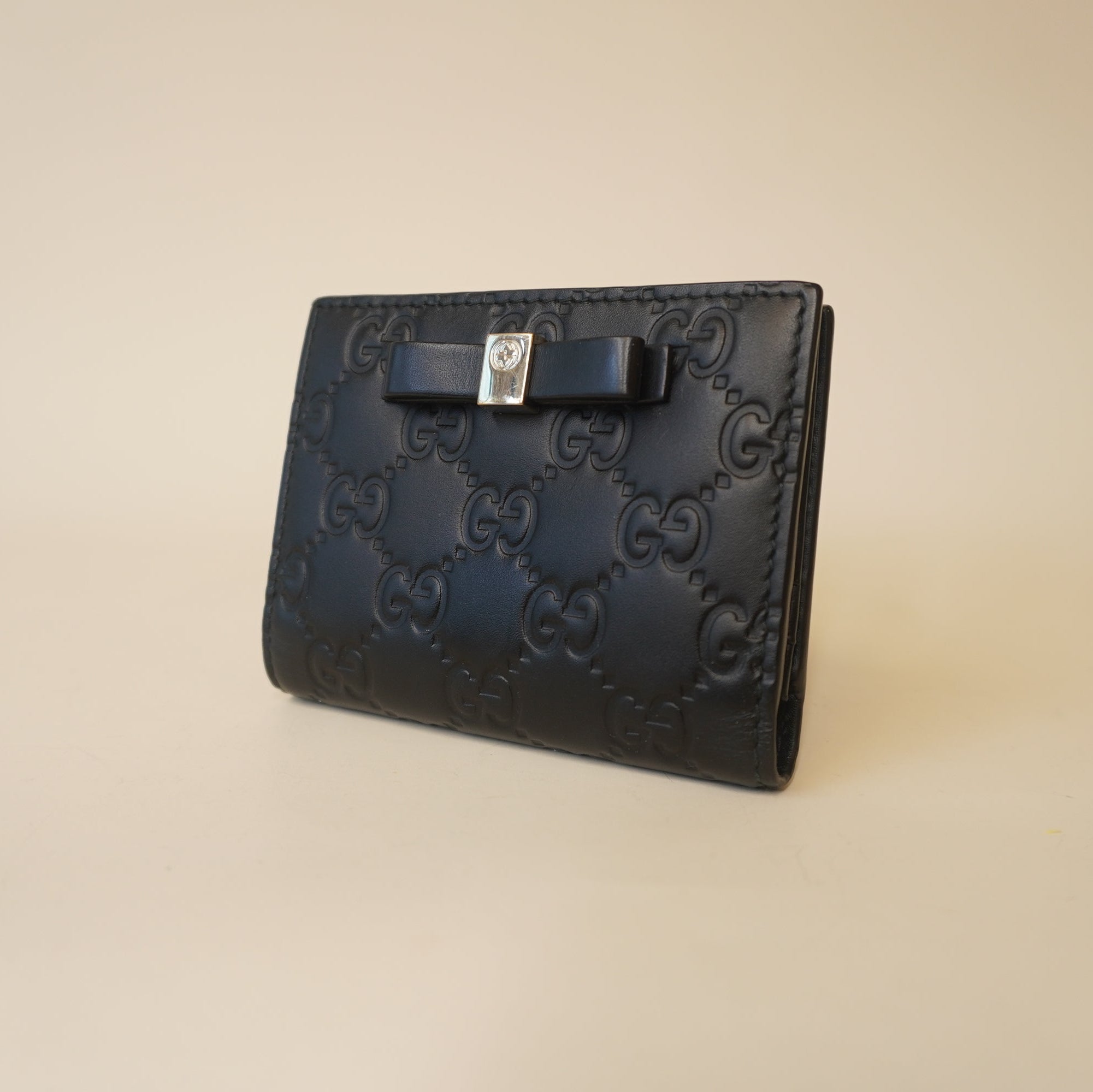 PRE-OWNED GG Black Guccissima Bow Bifold Wallet