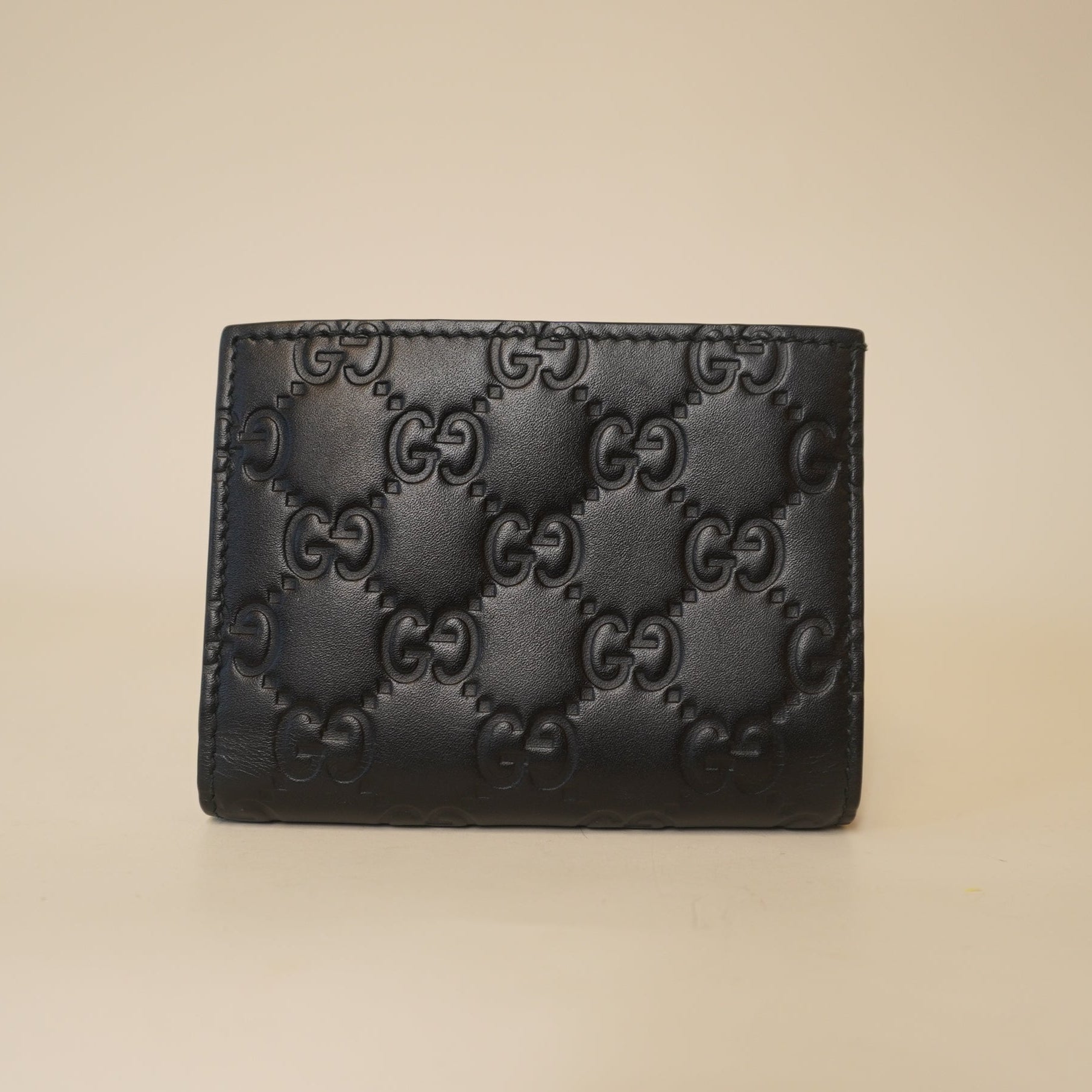 PRE-OWNED GG Black Guccissima Bow Bifold Wallet