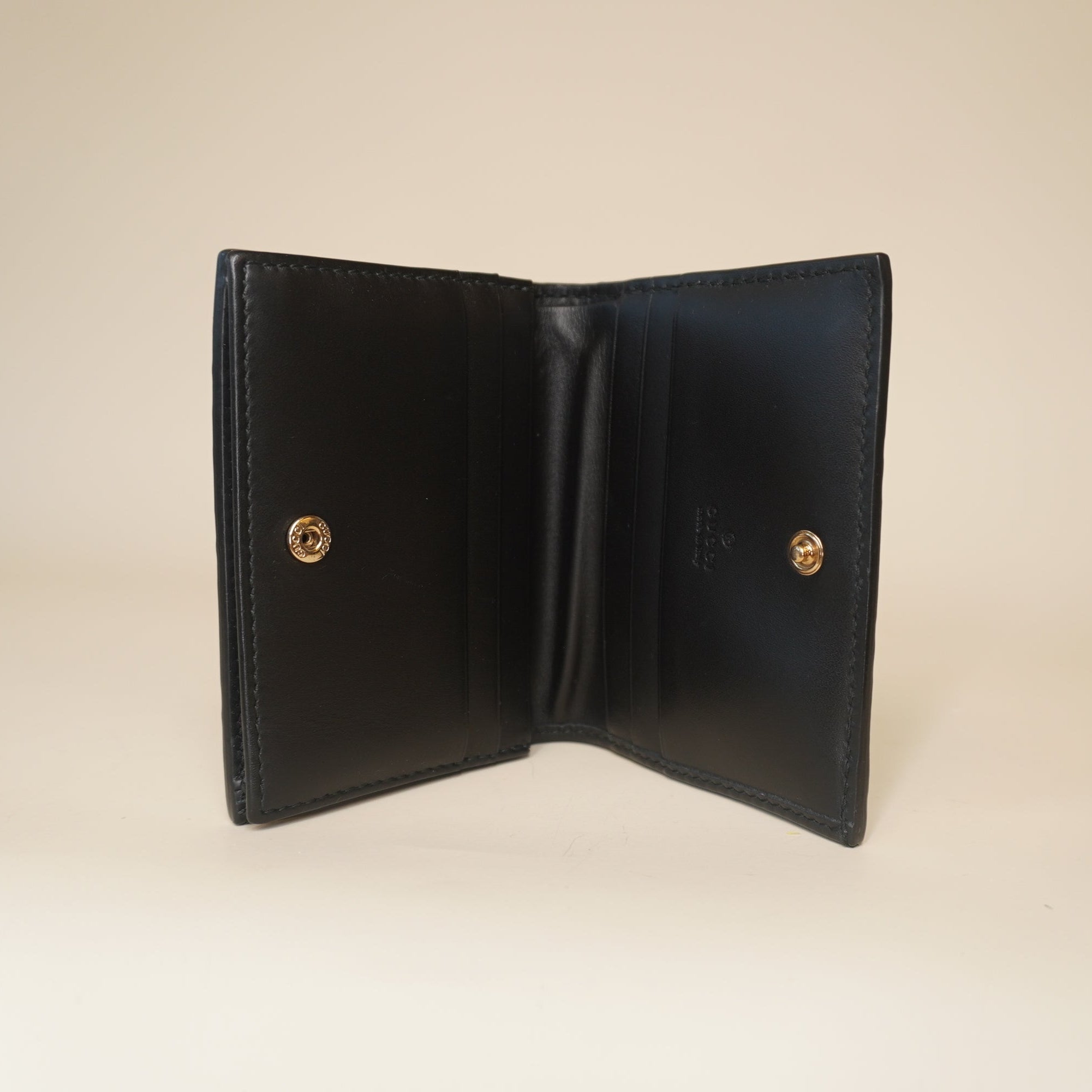 PRE-OWNED GG Black Guccissima Bow Bifold Wallet