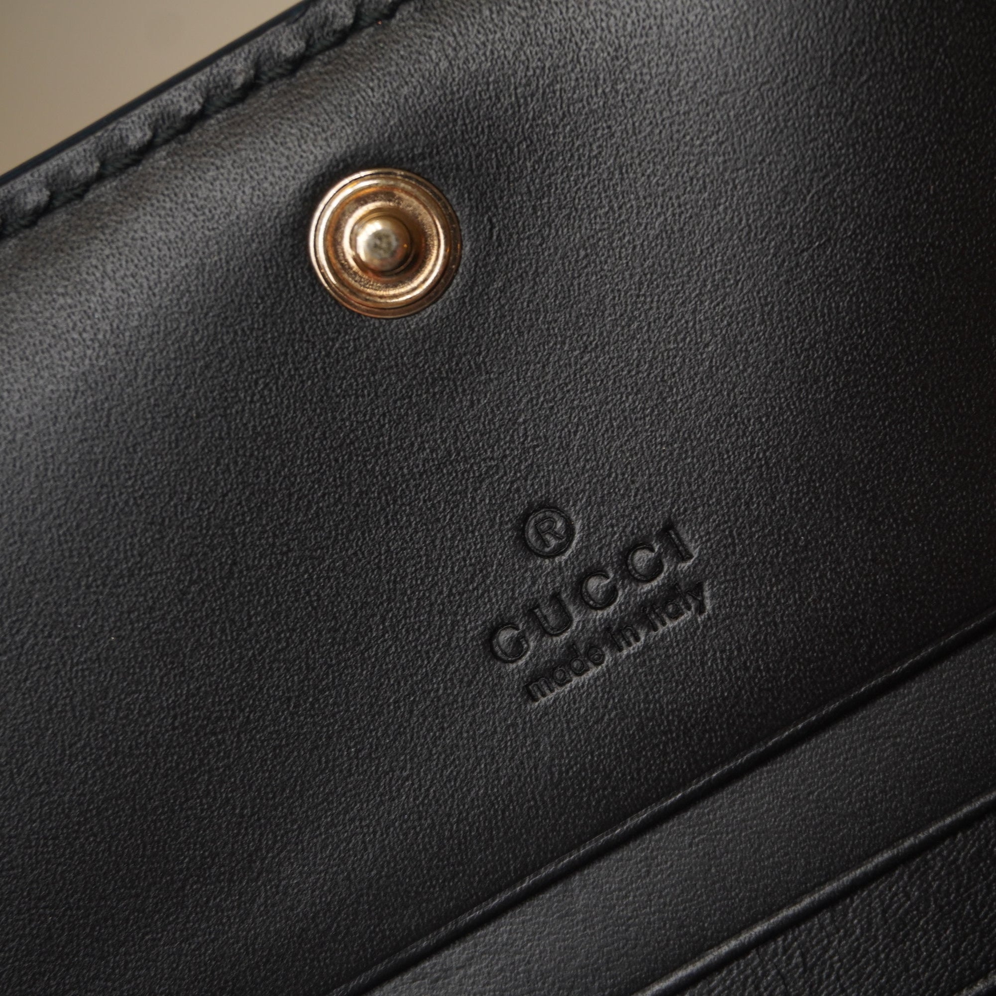 PRE-OWNED GG Black Guccissima Bow Bifold Wallet