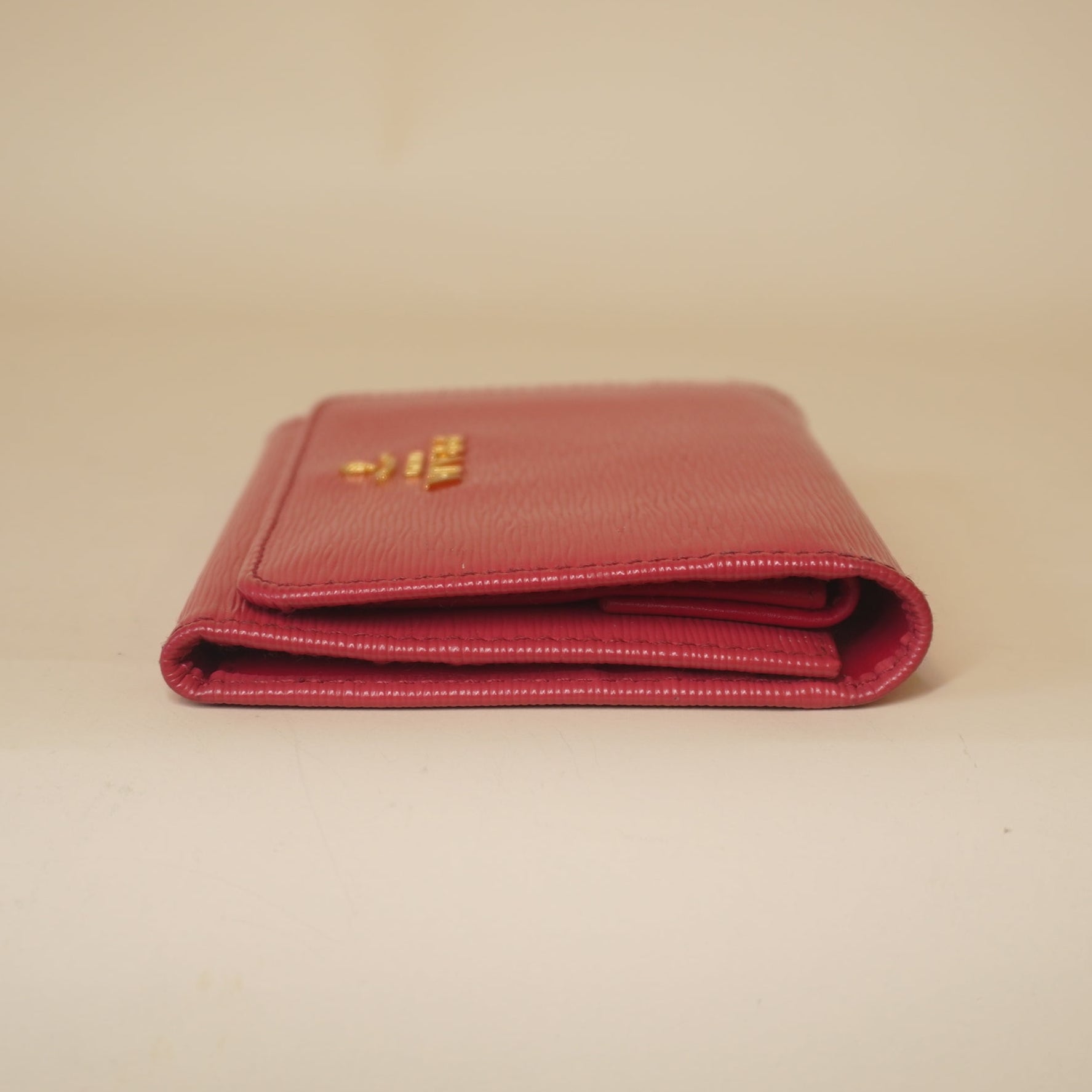 PRE-OWNED Pink Vitello Move Tri-Fold Compact Wallet Peonia