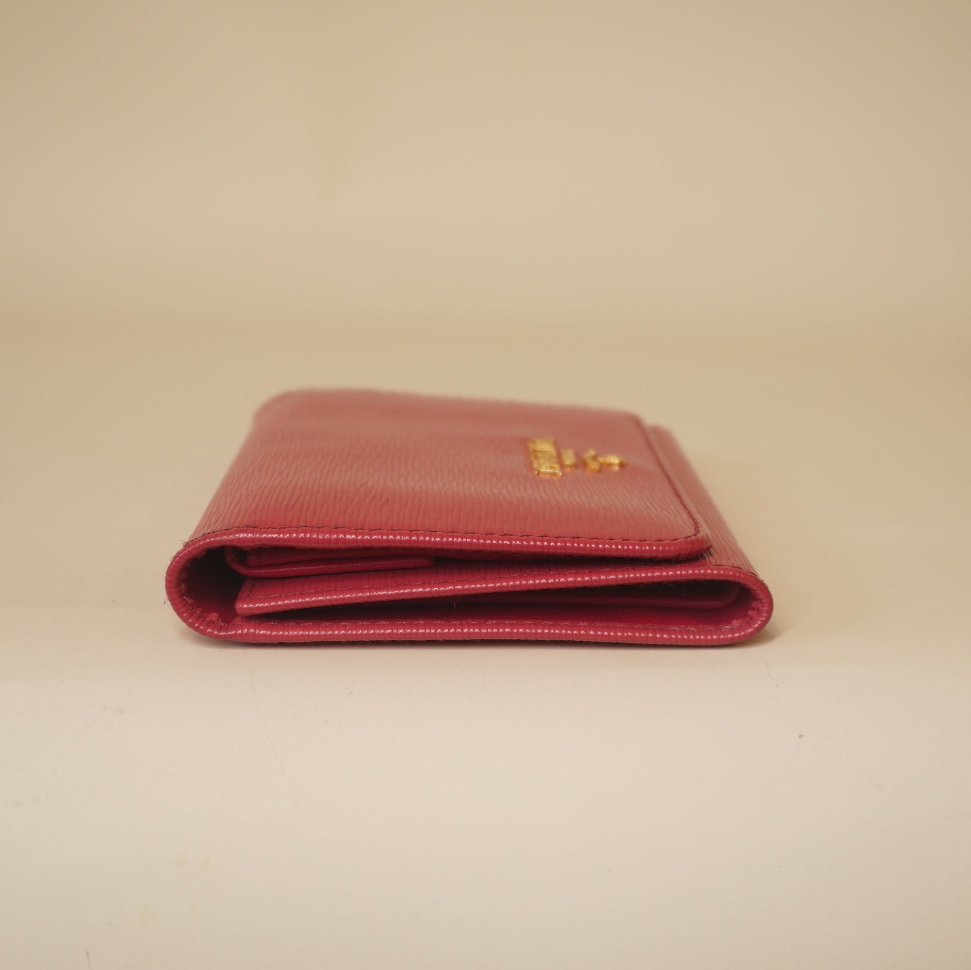 PRE-OWNED Pink Vitello Move Tri-Fold Compact Wallet Peonia