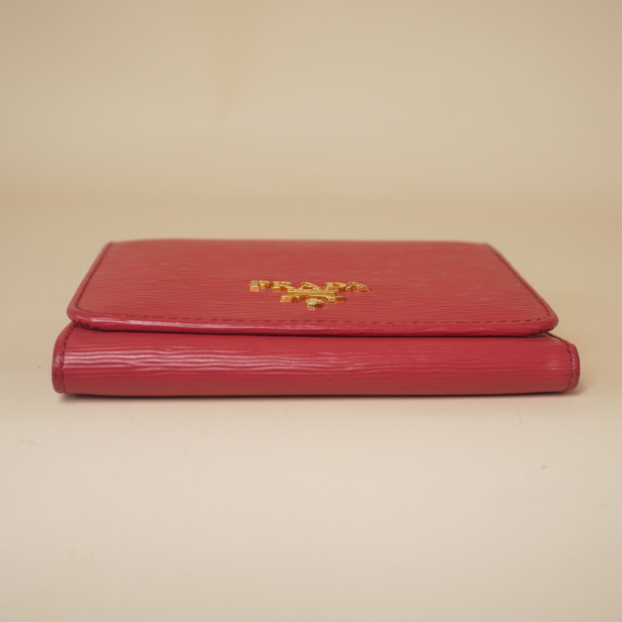 PRE-OWNED Pink Vitello Move Tri-Fold Compact Wallet Peonia