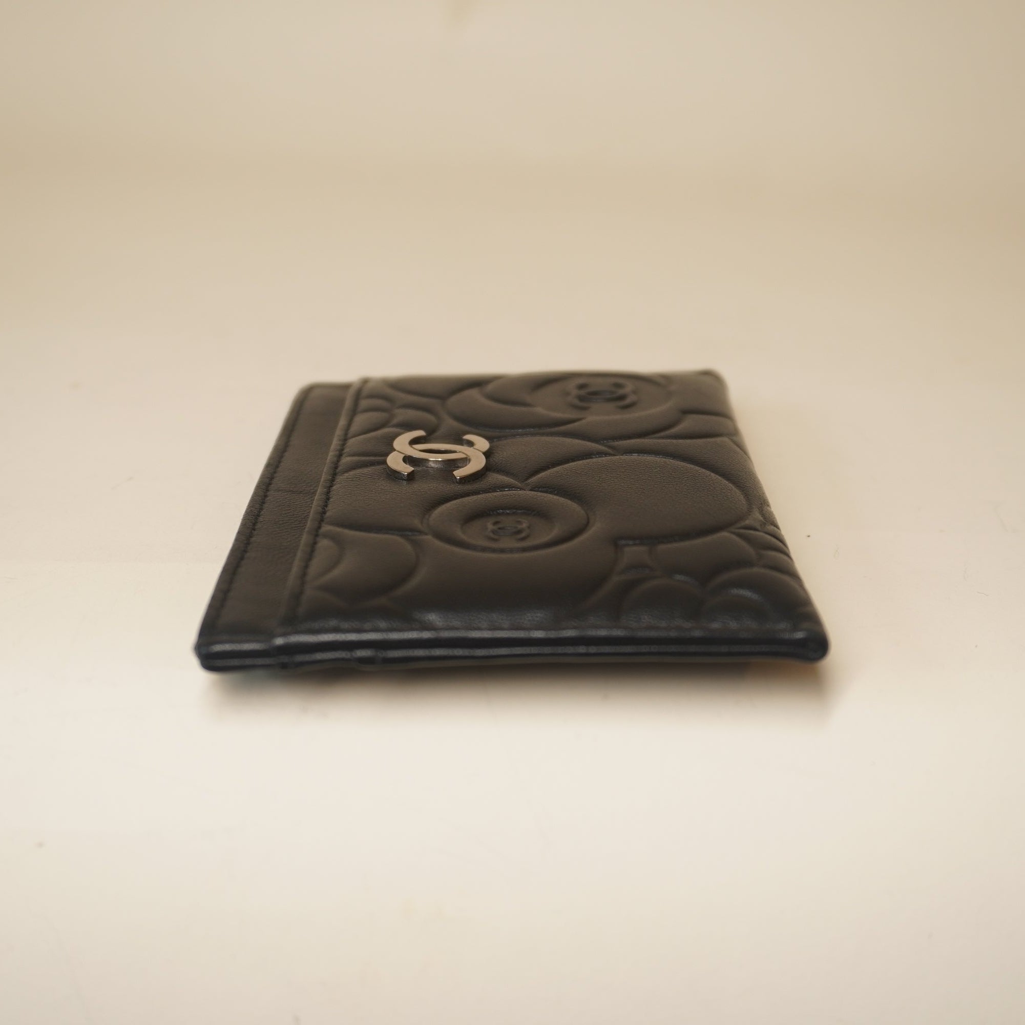 PRE-OWNED CC Black Lambskin Camellia Embossed Card Holder