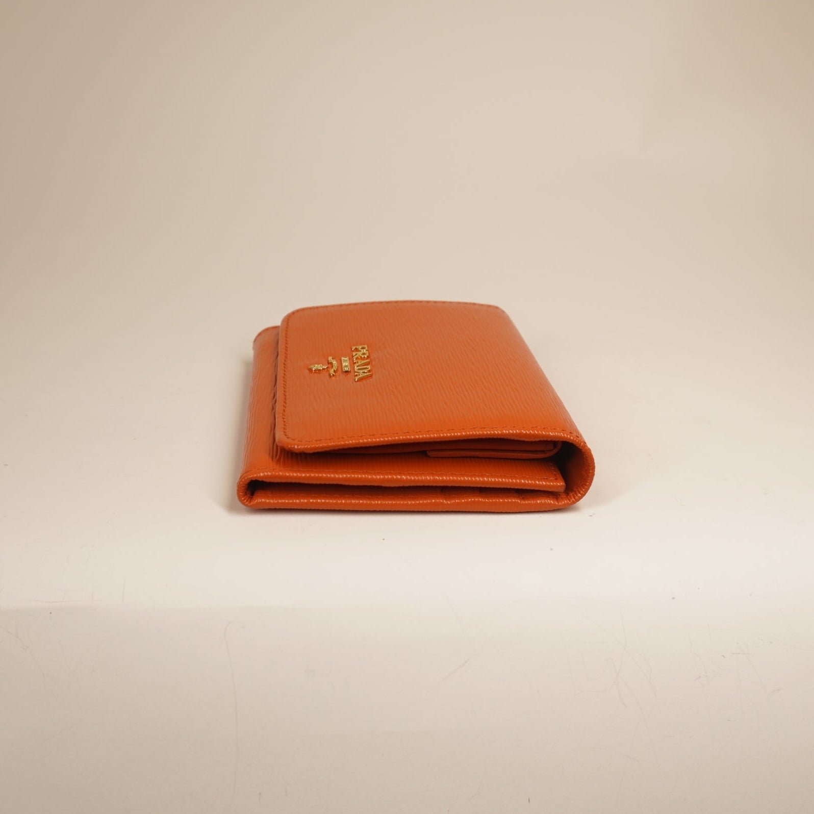 PRE-OWNED Vitello Move Bifold Wallet Papaya