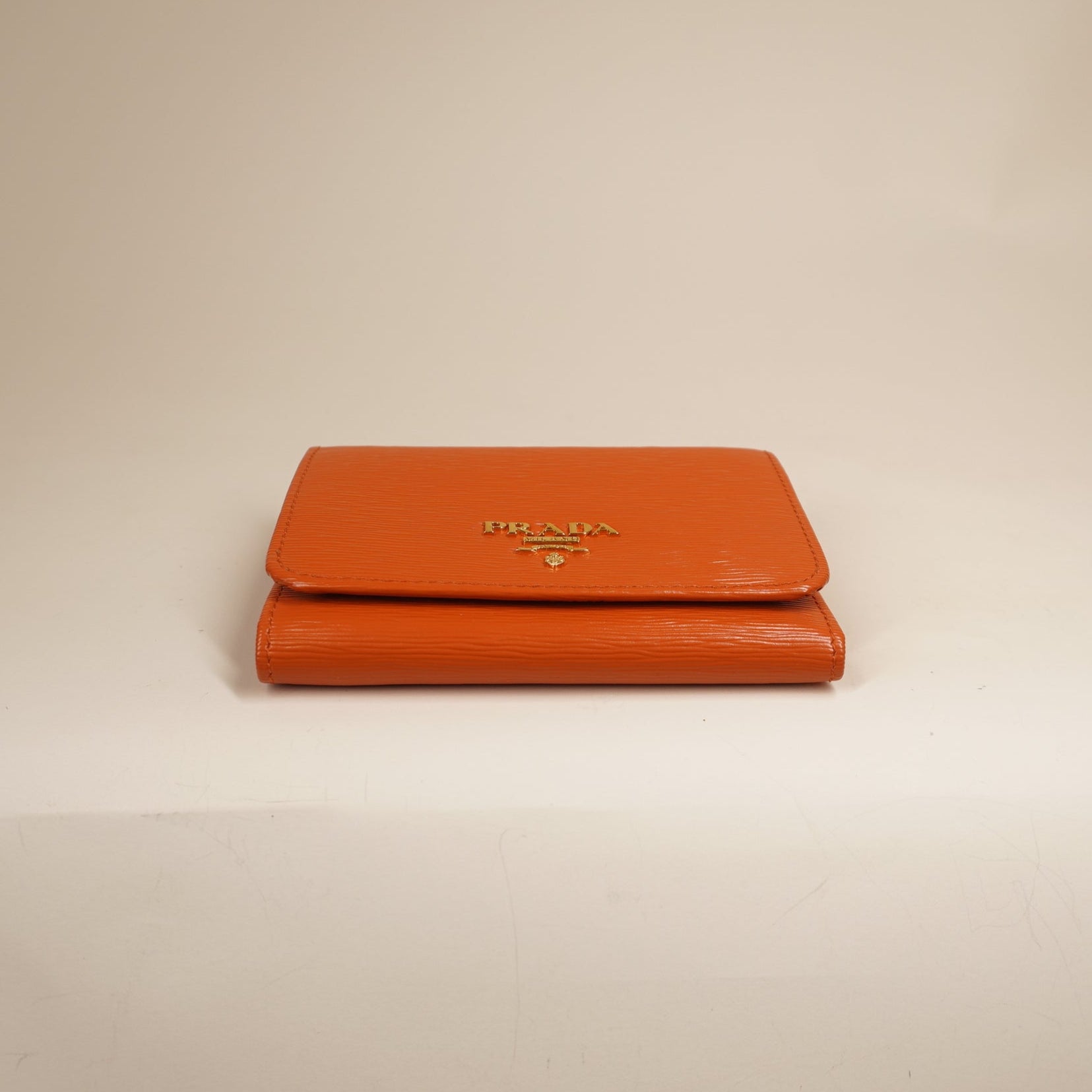 PRE-OWNED Vitello Move Bifold Wallet Papaya