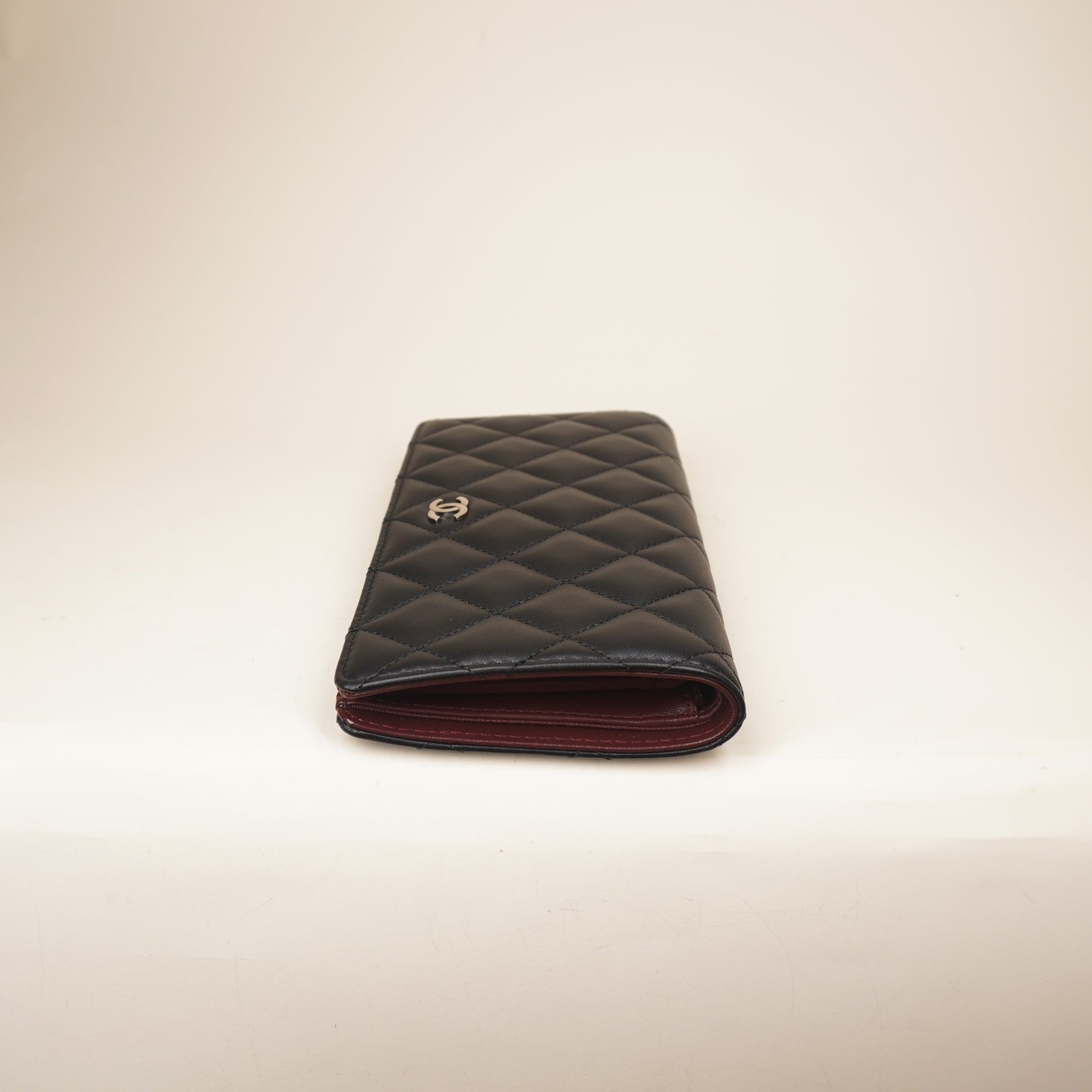 PRE-OWNED CC Black Lambskin Quilted Yen Wallet