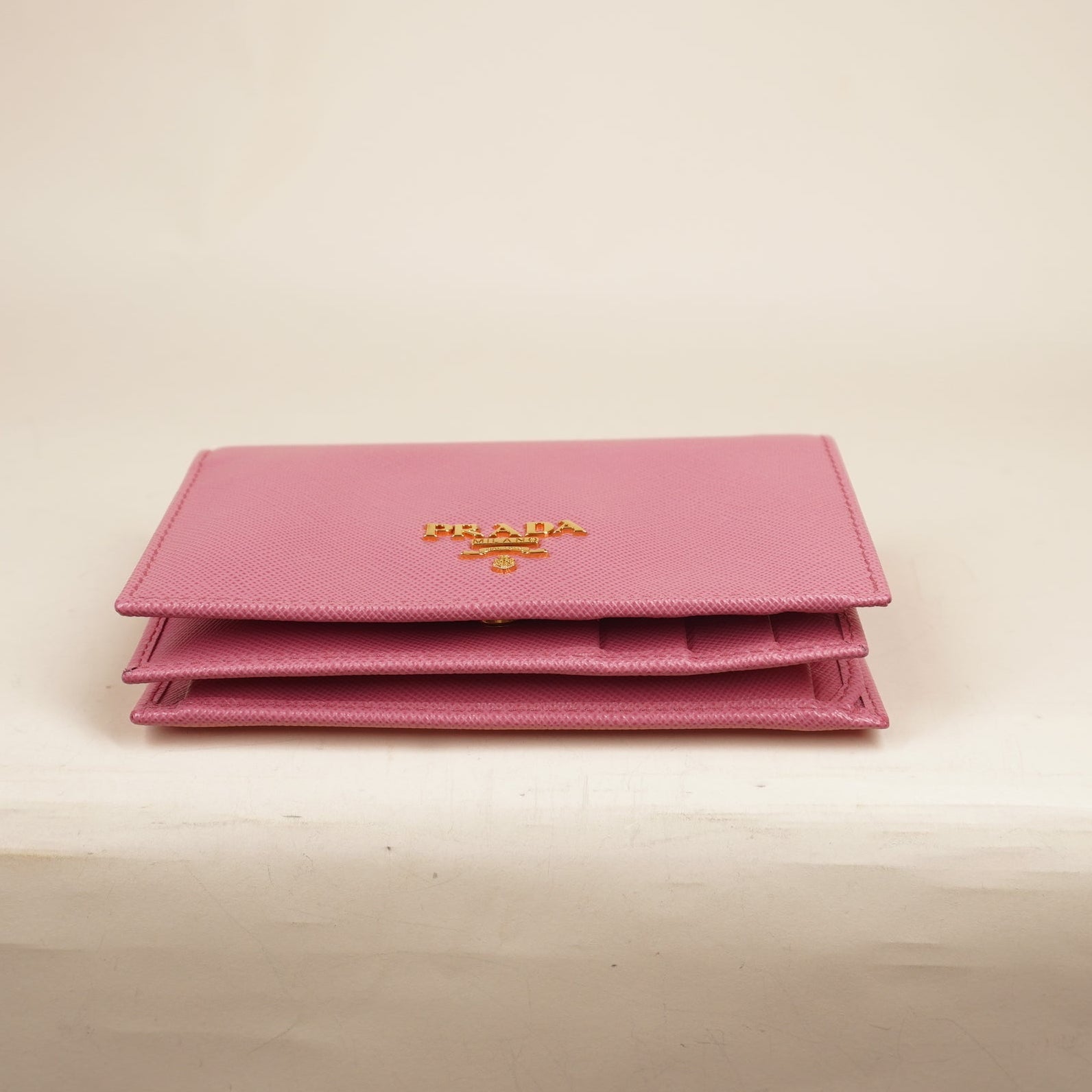PRE-OWNED Saffiano Metal Compact Snap Bi-Fold Wallet Petalo