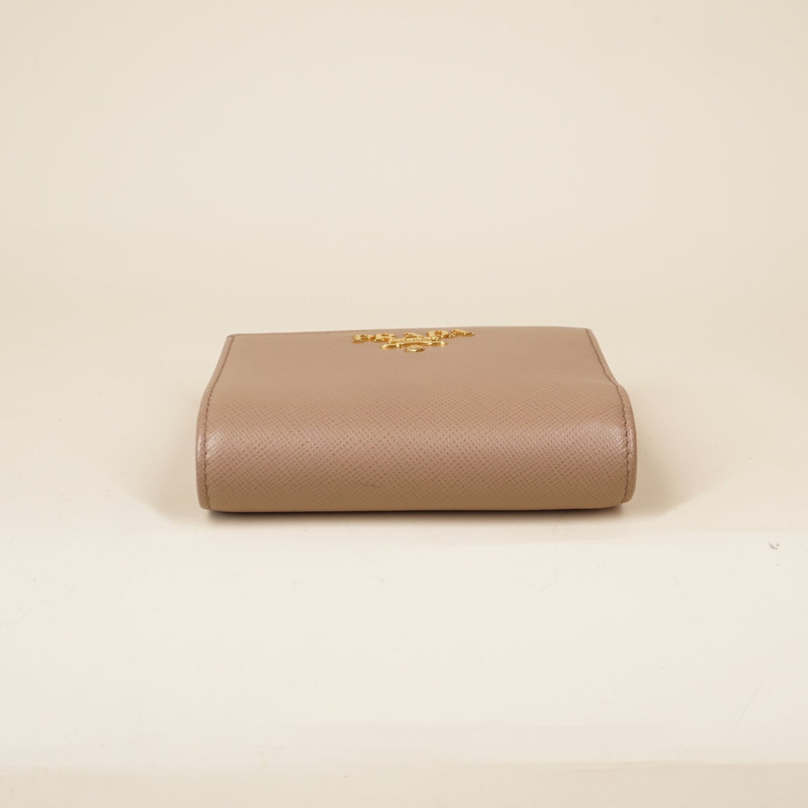 PRE-OWNED Beige Saffiano Metal Leather Frame Compact Wallet