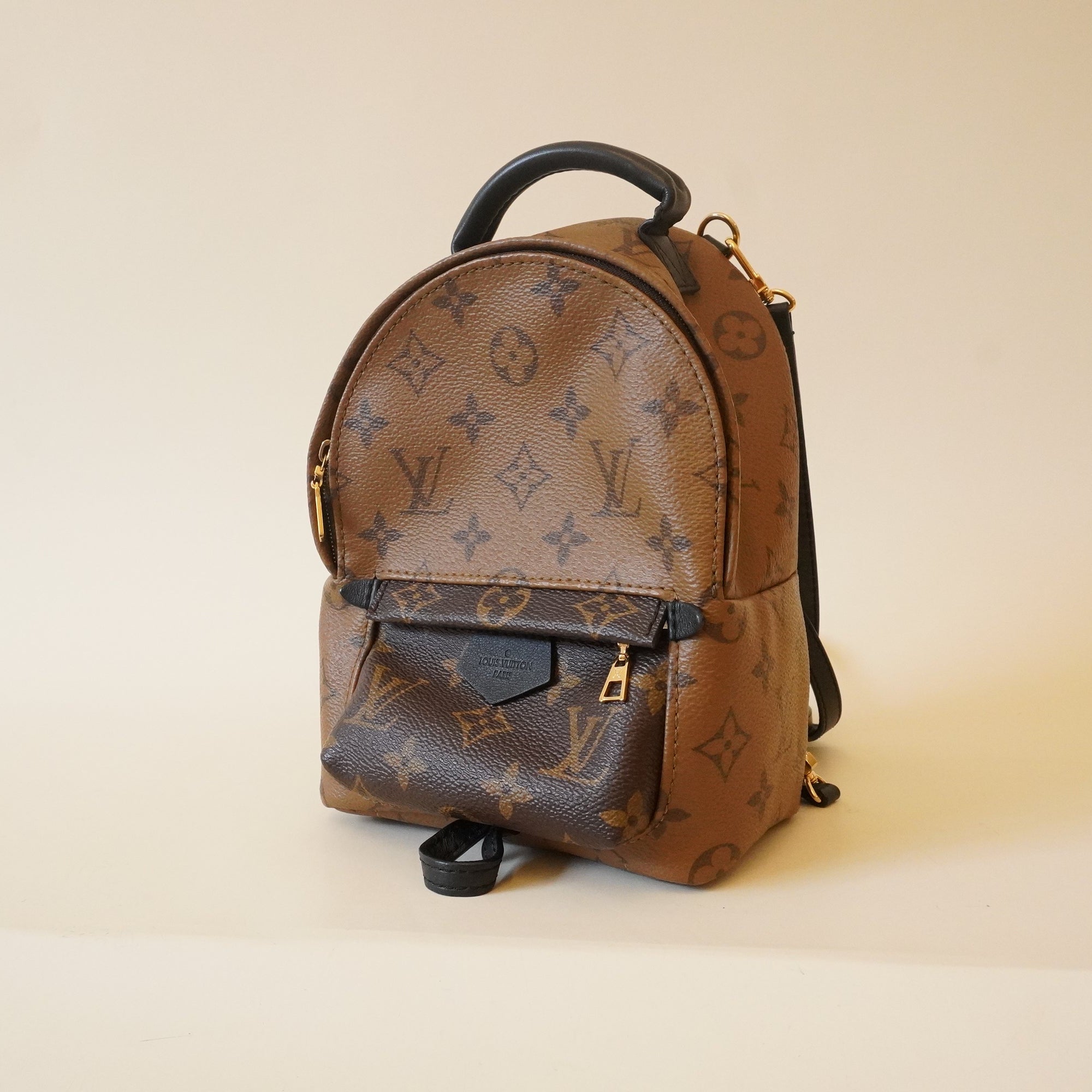 PRE-OWNED LV Monogram Canvas Reverse Mini Palm Spring Backpack