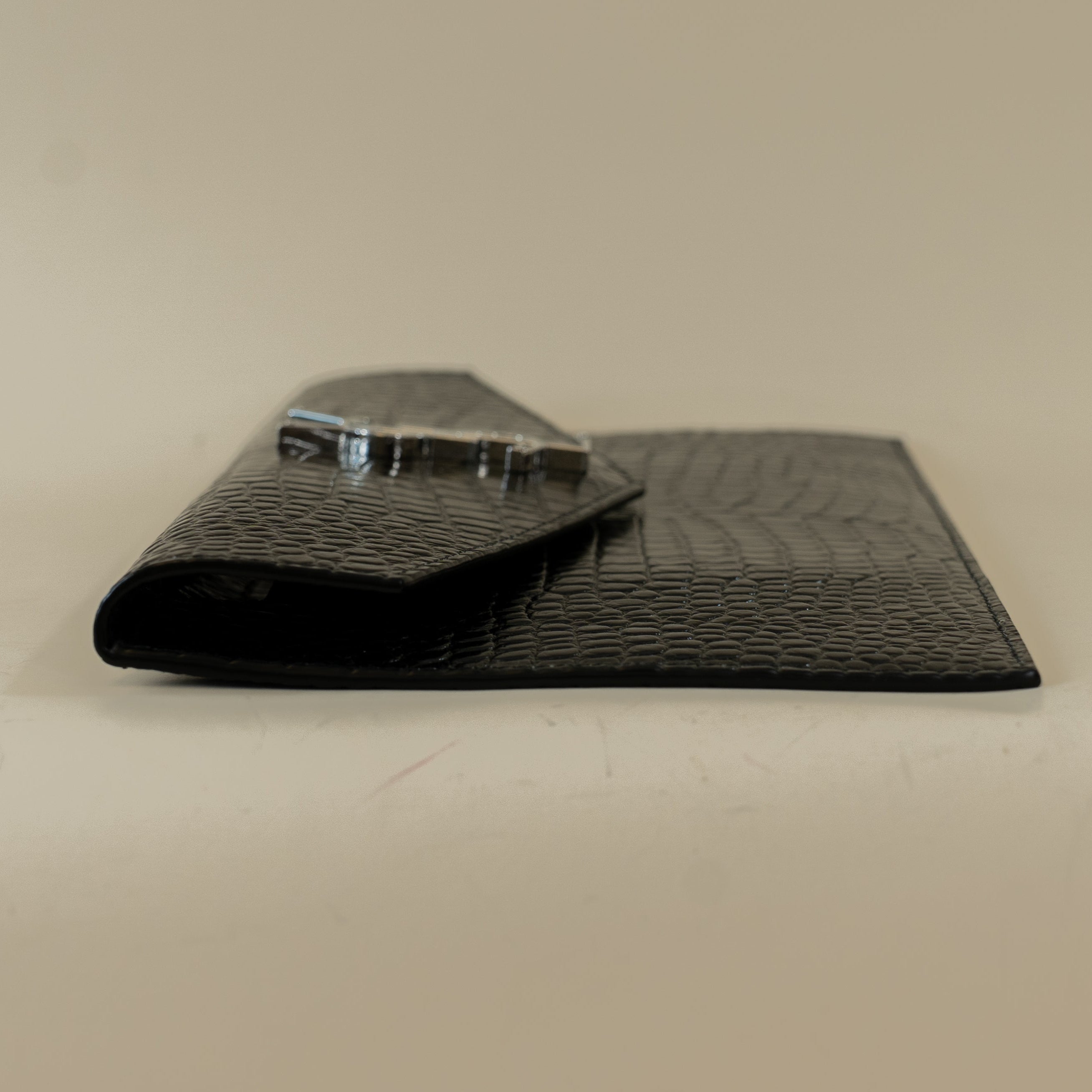 PRE-OWNED Black Calfskin Crocodile Embossed Uptown Monogram Clutch