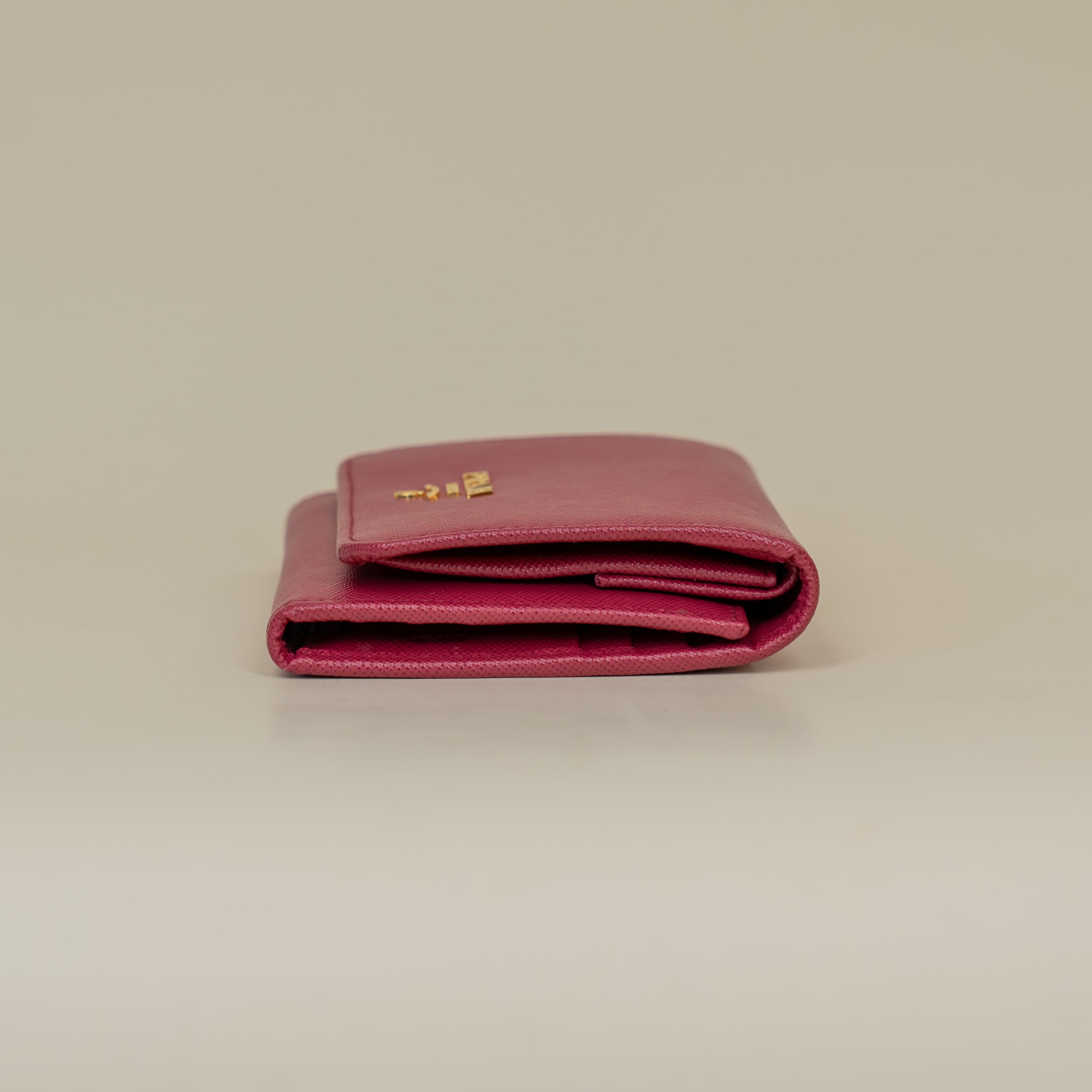 PRE-OWNED Pink Saffiano Metal French Flap Compact Wallet