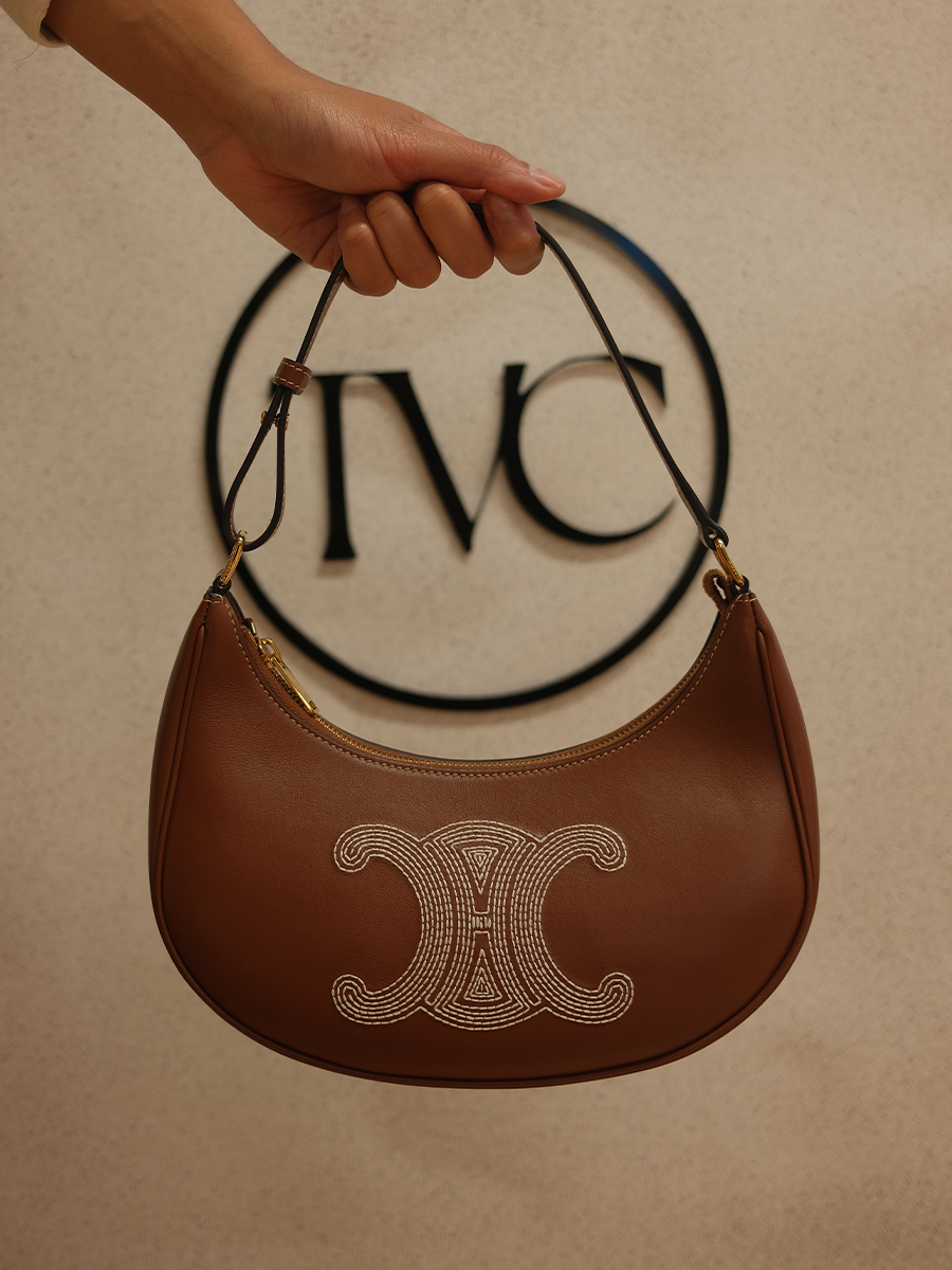 Authenticated pre-loved Céline bag held in front of The Vintage Caffé logo