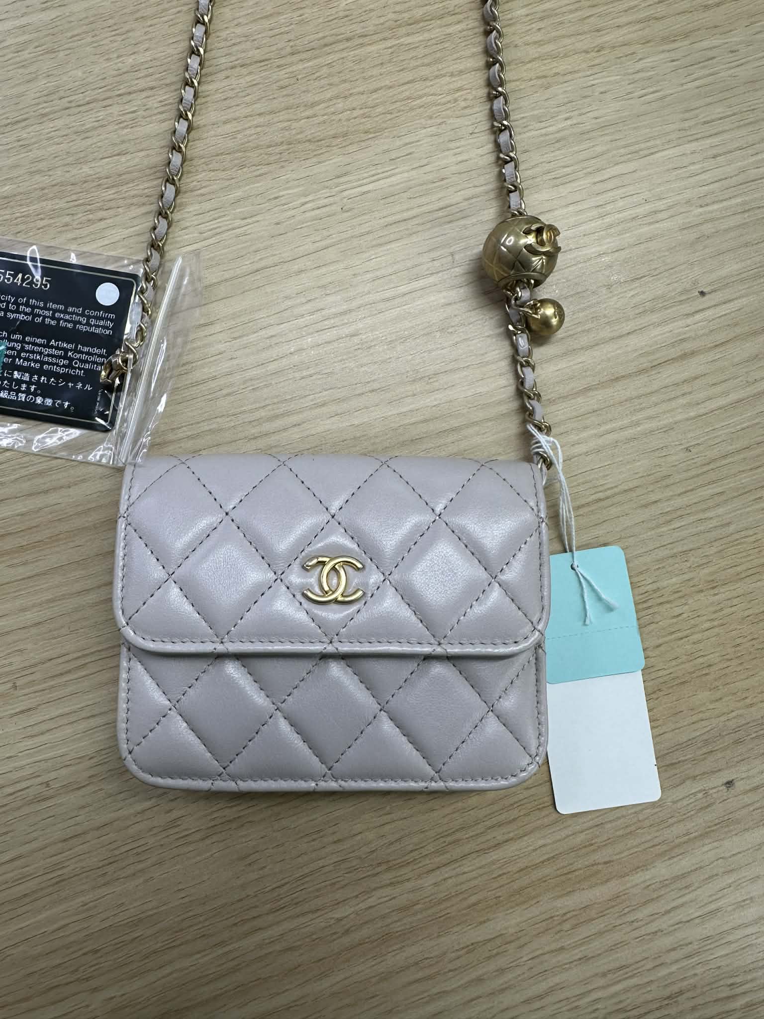 PRE-OWNED CC Chanel
Mini Pearl Crush Clutch With Chain