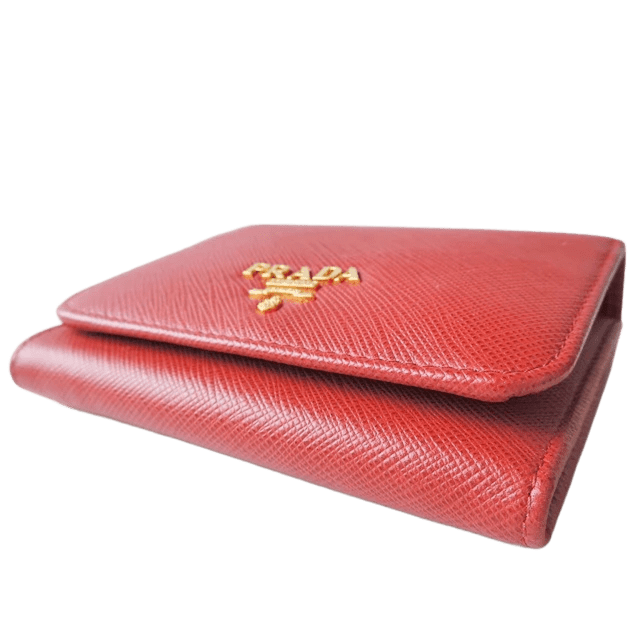 Cartera de tres pliegues de cuero rojo de segunda mano