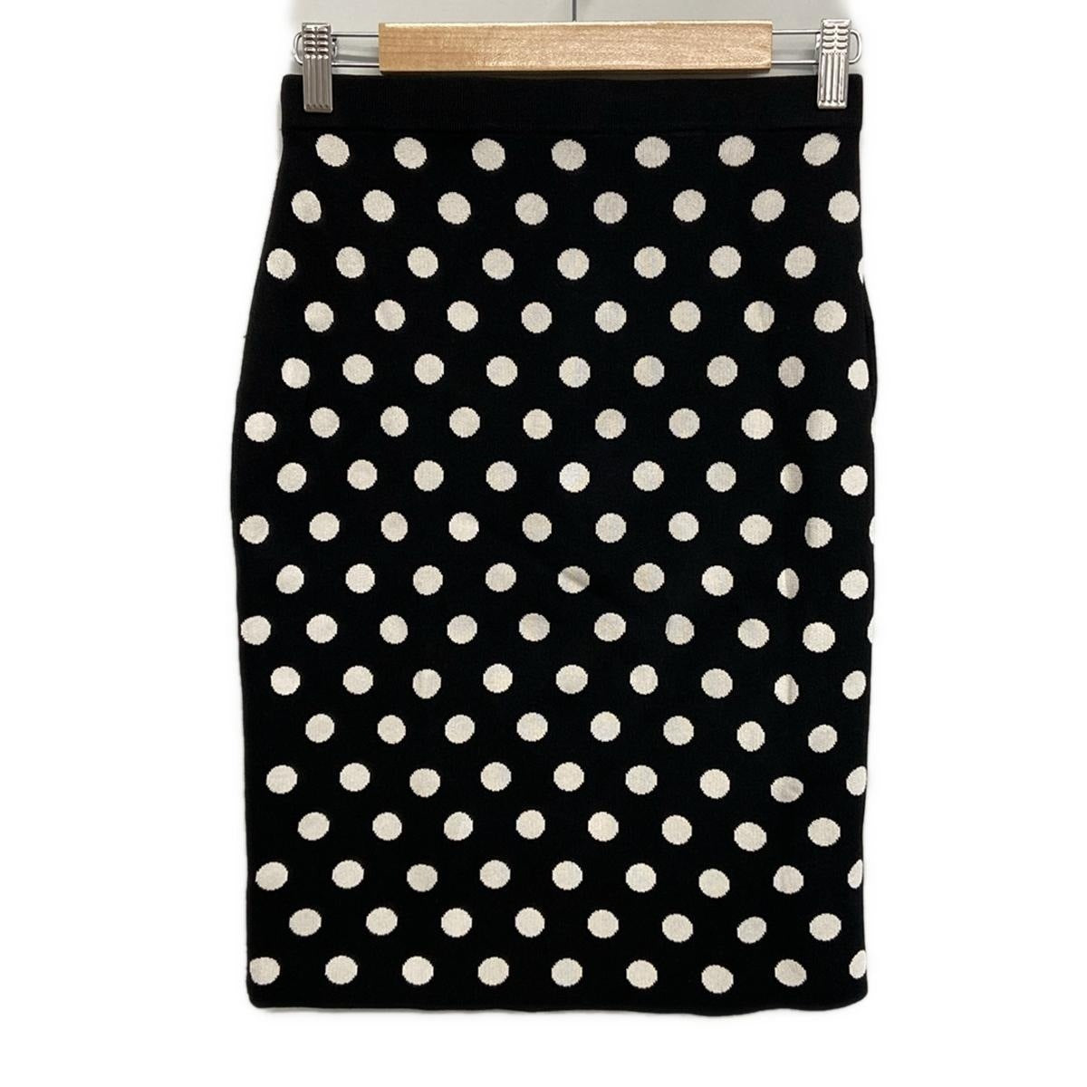 Falda CH de lunares blancos y negros de segunda mano