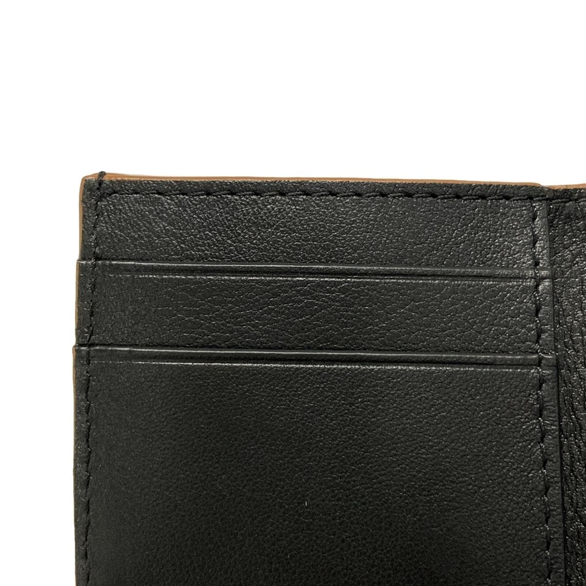 PRE-OWNED Black Brown Pebble Grain Calf Anagram Trifold Wallet