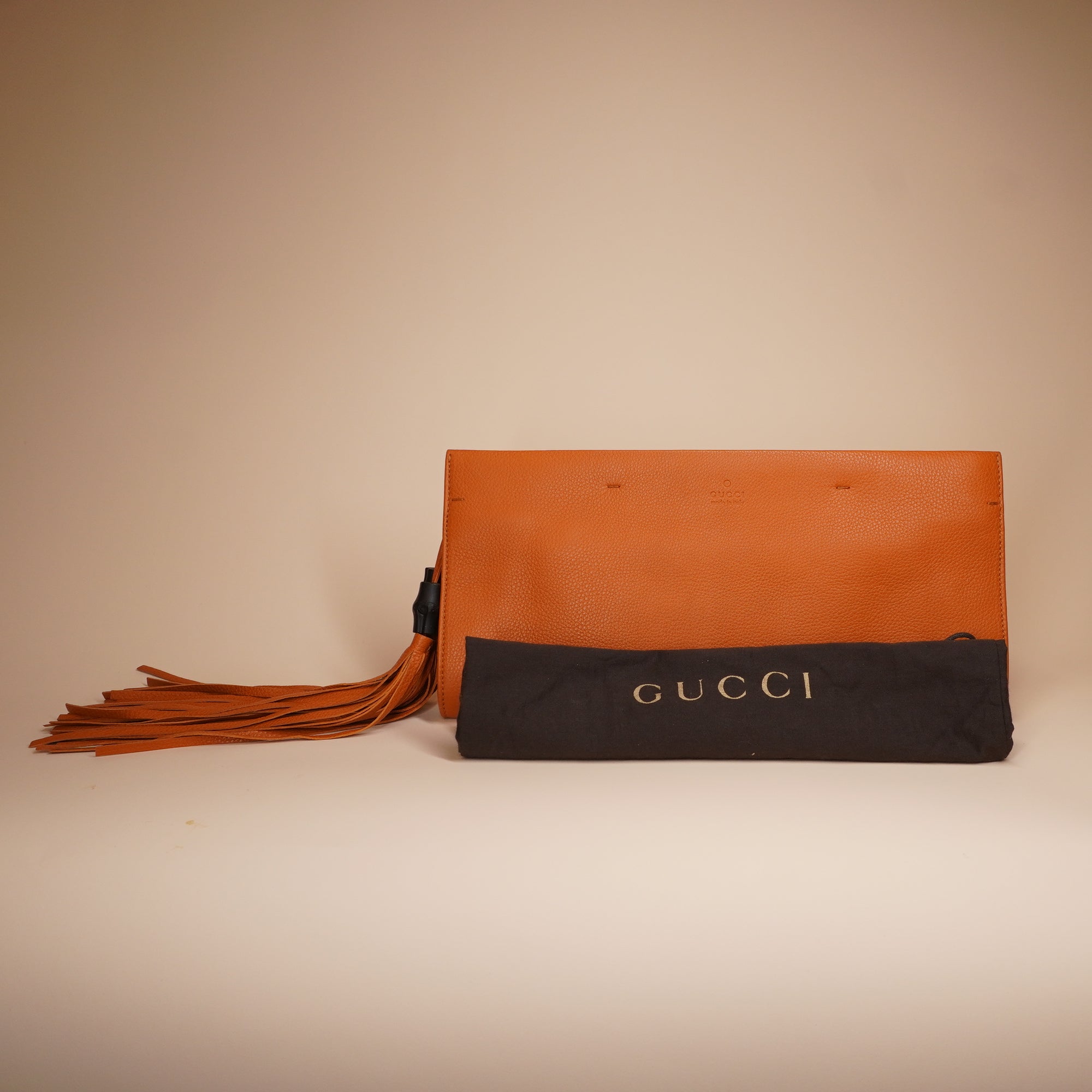 PRE-OWNED GG Orange Leather Bamboo Tassel Clutch