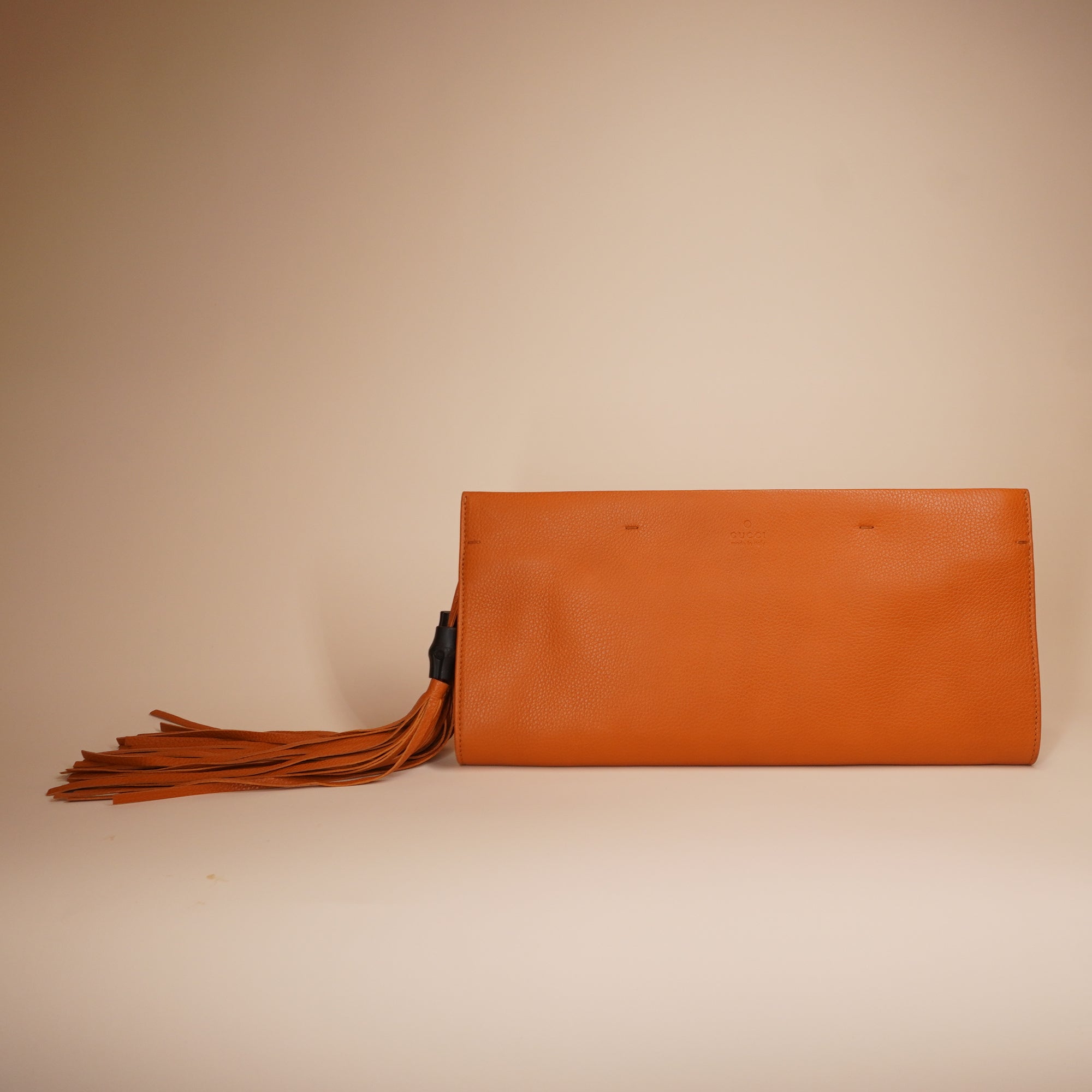 PRE-OWNED GG Orange Leather Bamboo Tassel Clutch