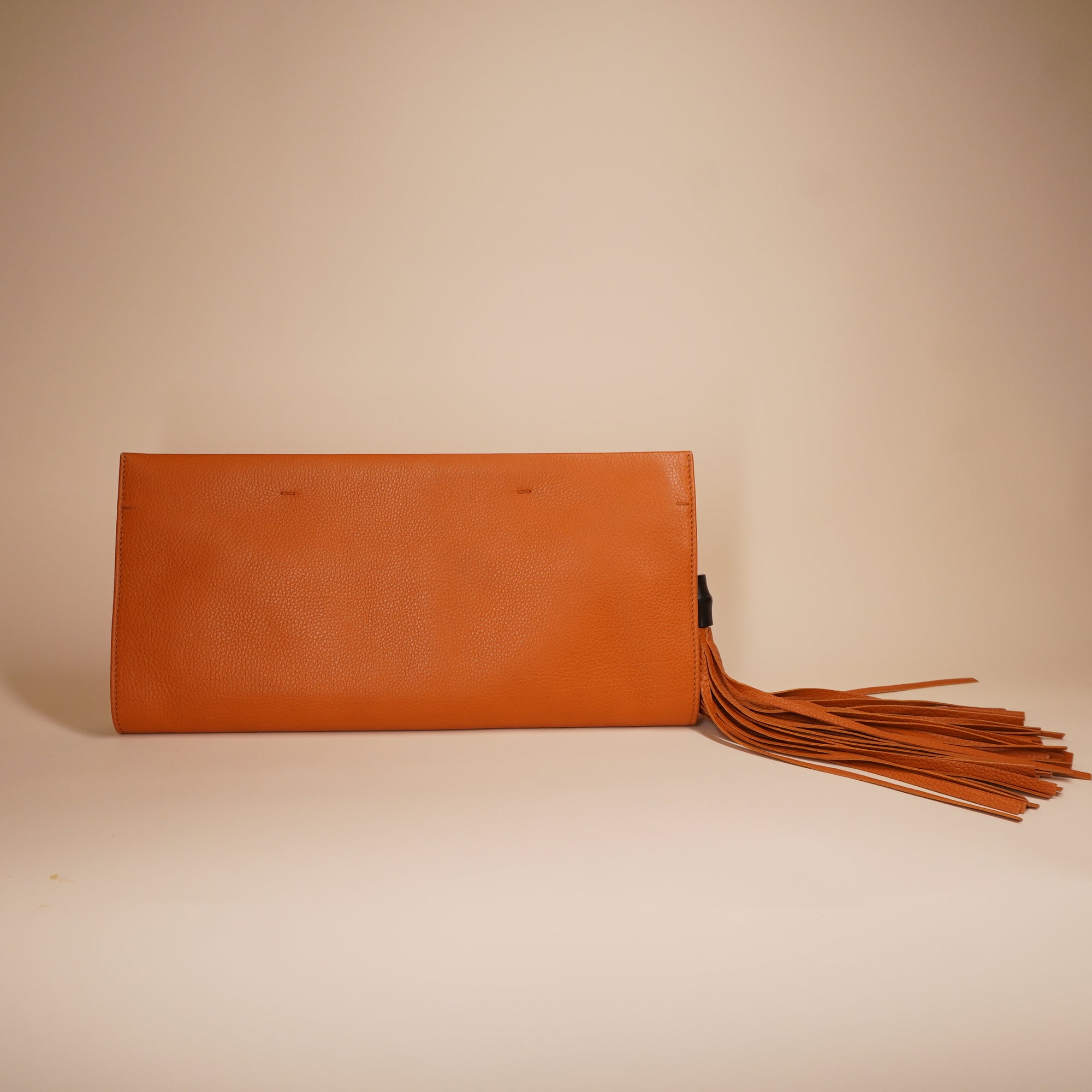 PRE-OWNED GG Orange Leather Bamboo Tassel Clutch