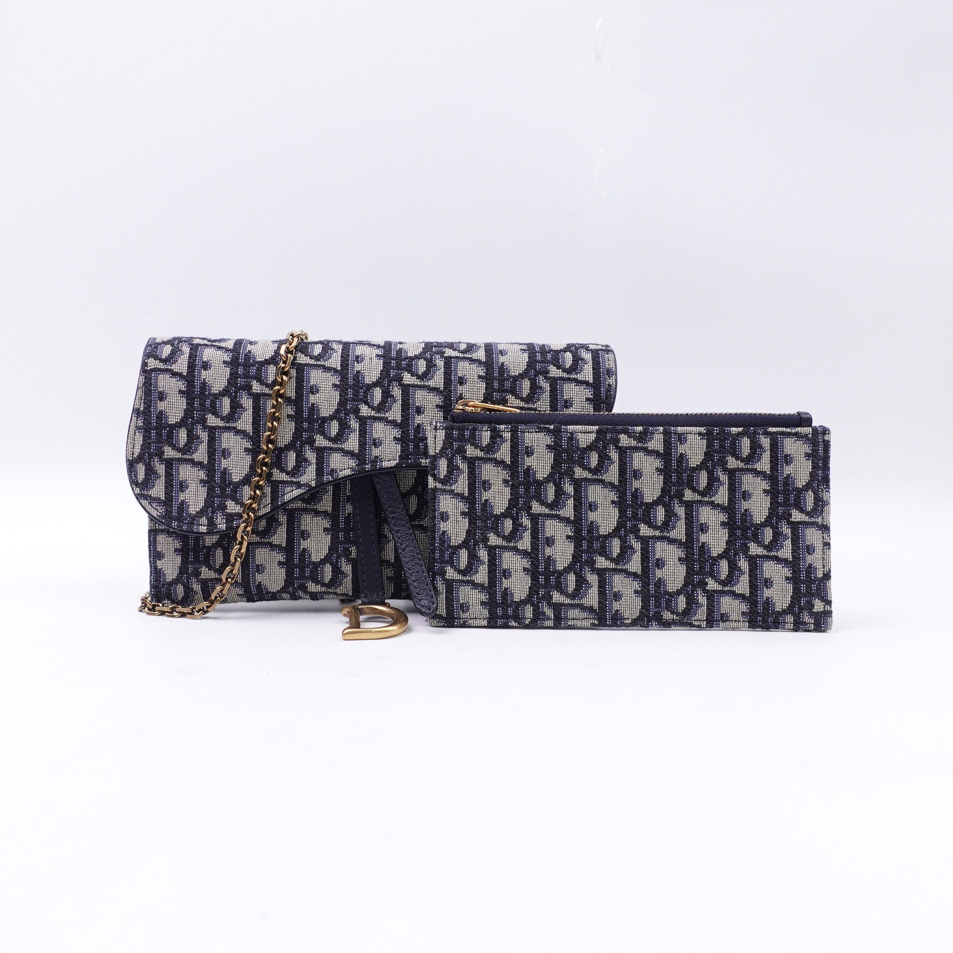 Cartera de lona oblicua azul marino de segunda mano con cadena