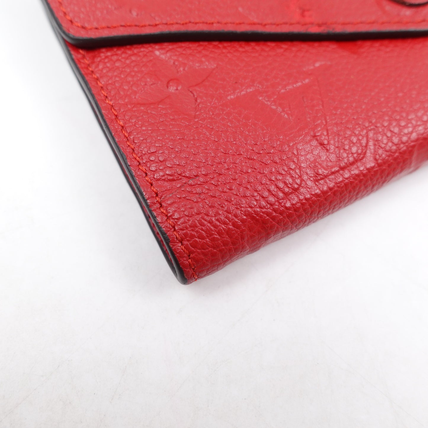 PRE-OWNED LV Red Monogram Empreinte Curieuse Compact Short Wallet