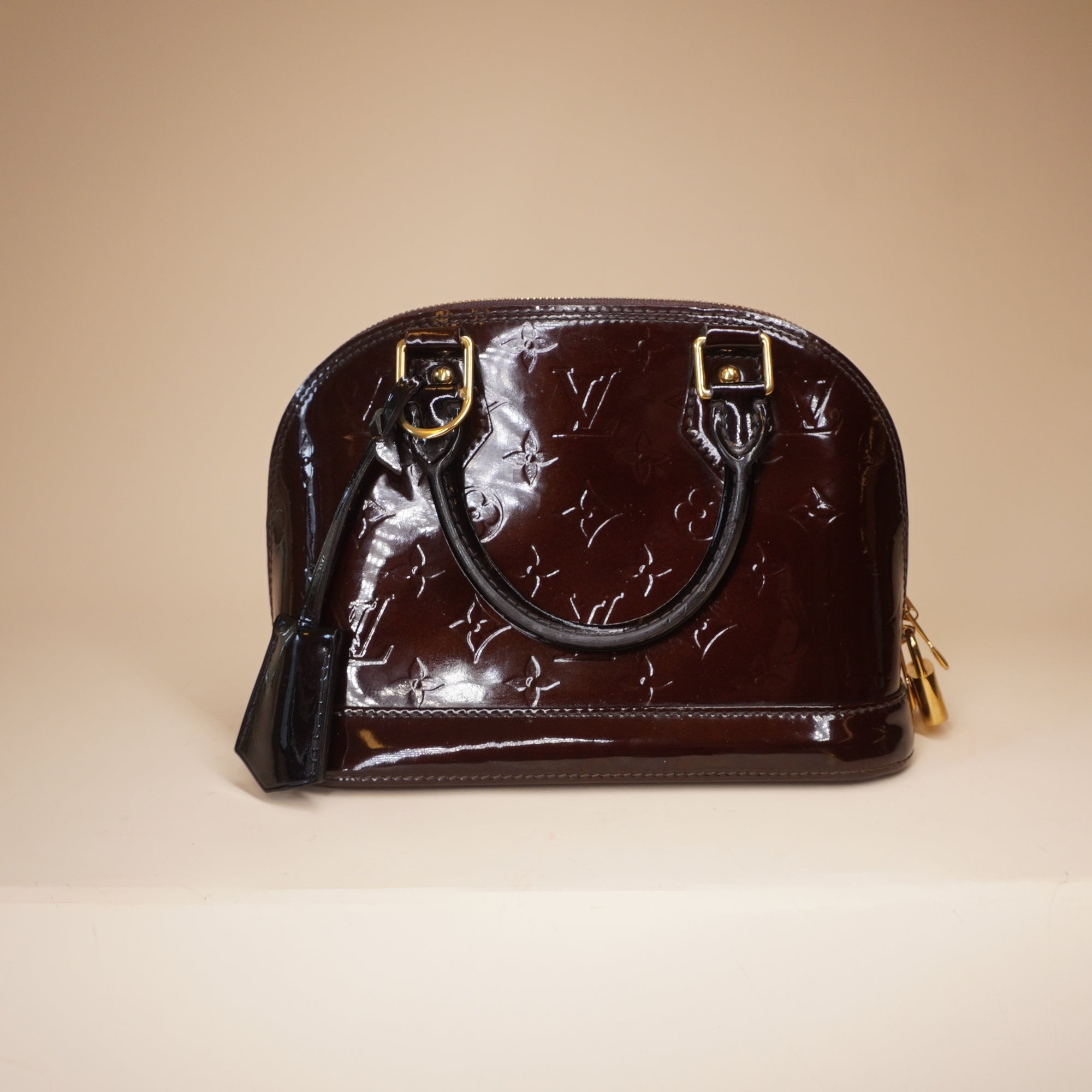 PRE-OWNED LV Alma BB Vernis Burgundy Monogram Handbag
