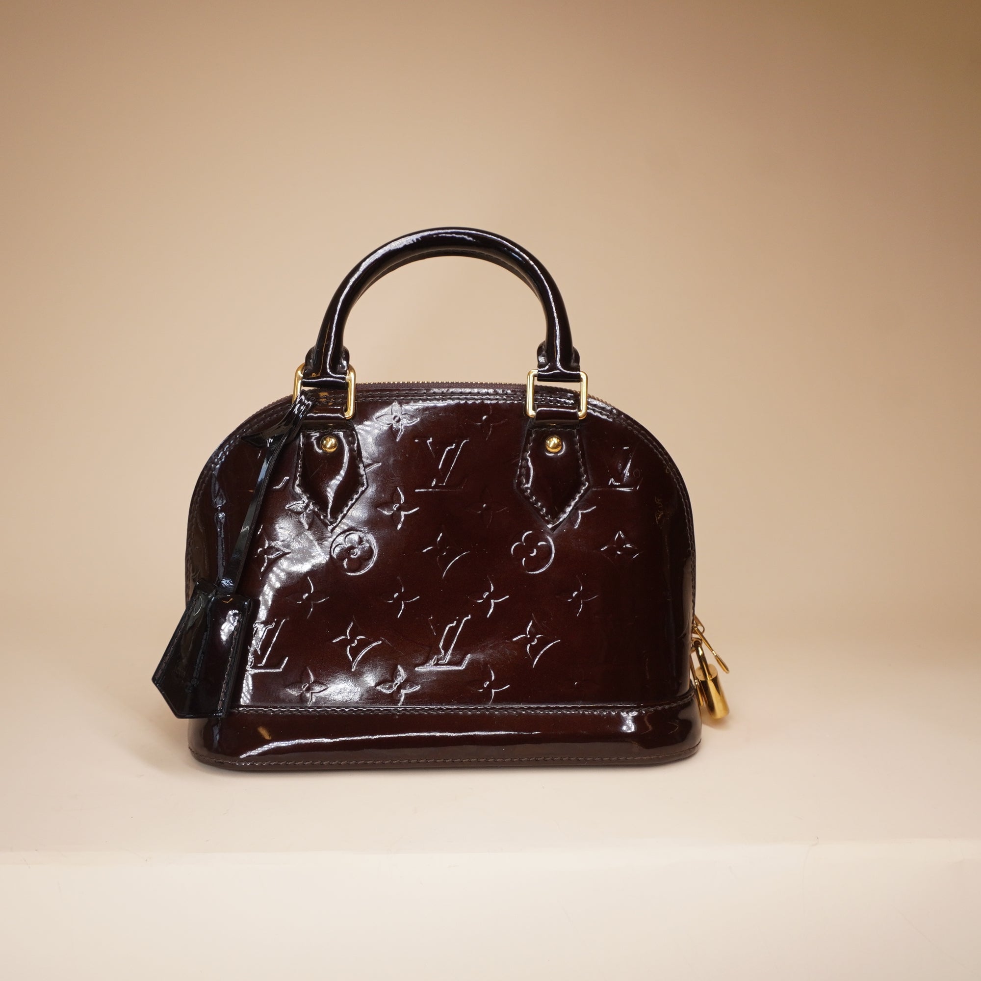 PRE-OWNED LV Alma BB Vernis Burgundy Monogram Handbag