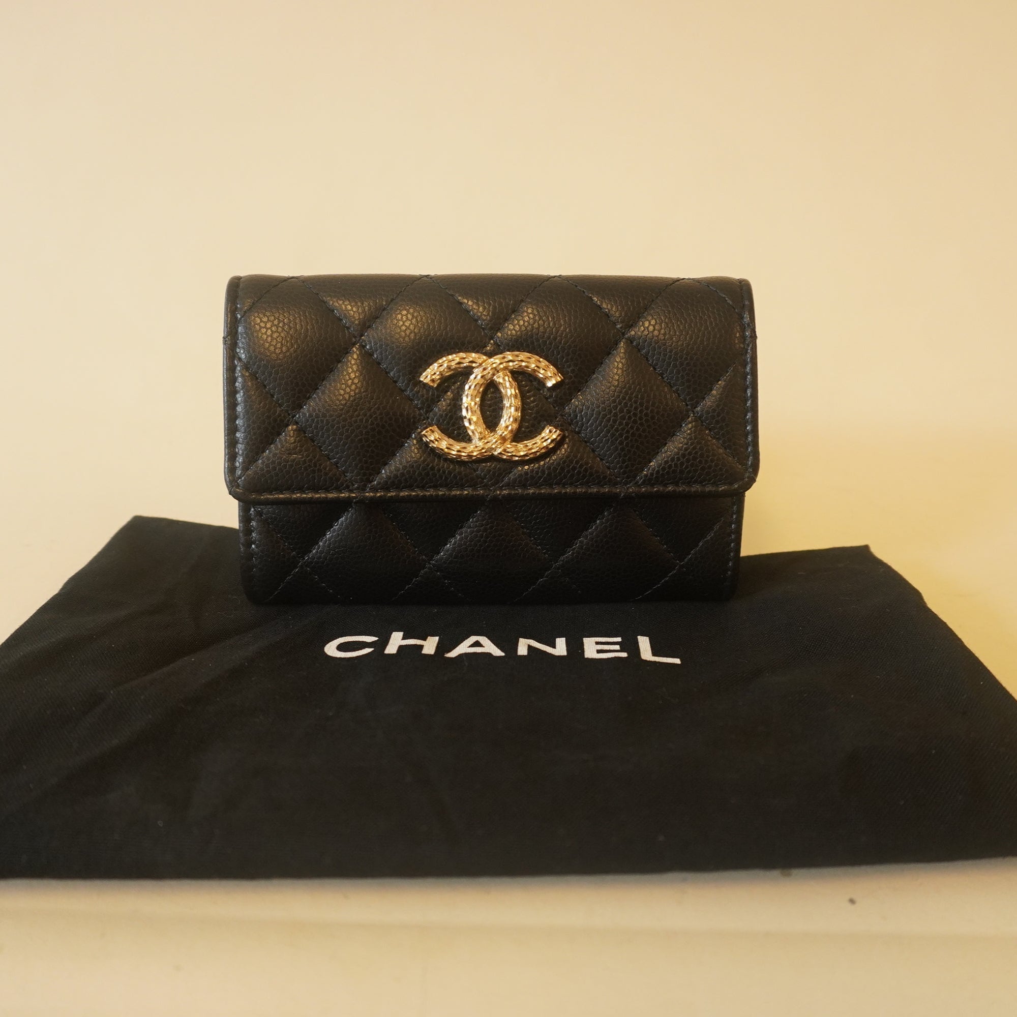 PRE-OWNED Caviar Metal Perforated Quilted CC Flap Card Holder Black