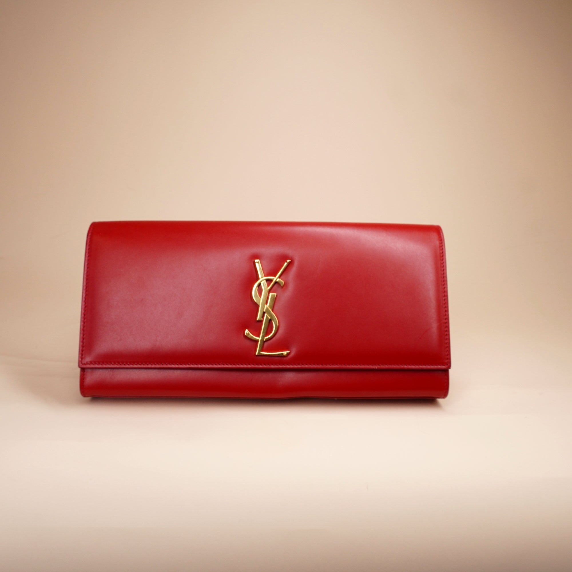 PRE-OWNED Red Leather Cassandre Clutch