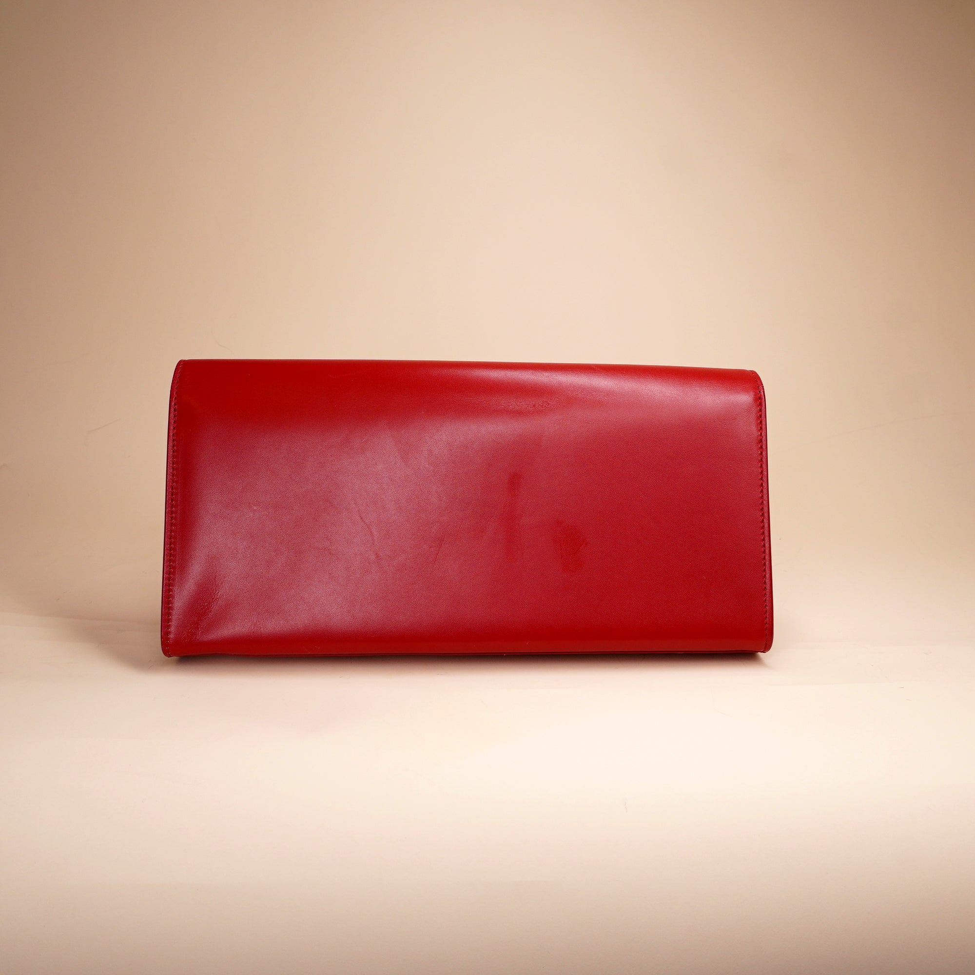 PRE-OWNED Red Leather Cassandre Clutch