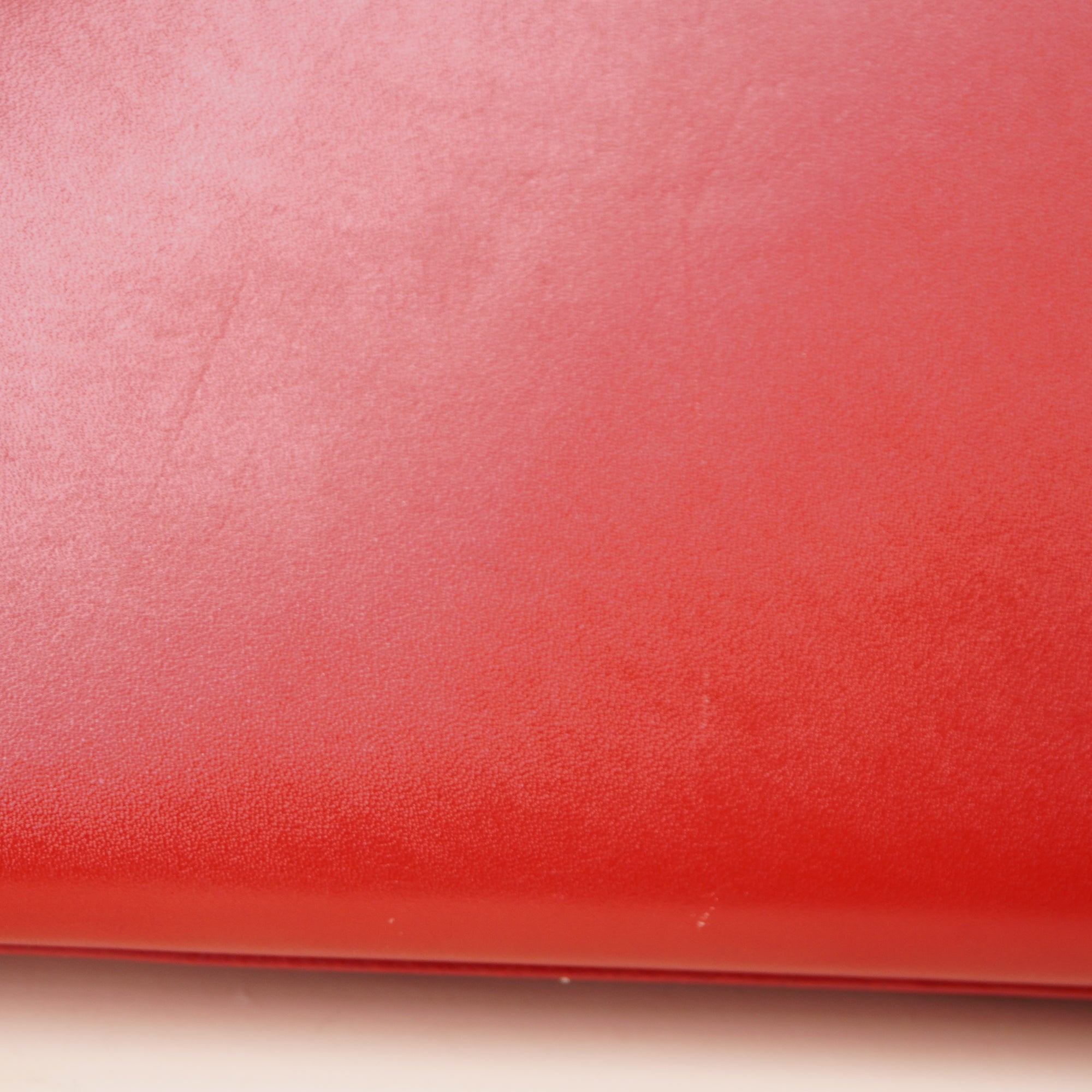 PRE-OWNED Red Leather Cassandre Clutch