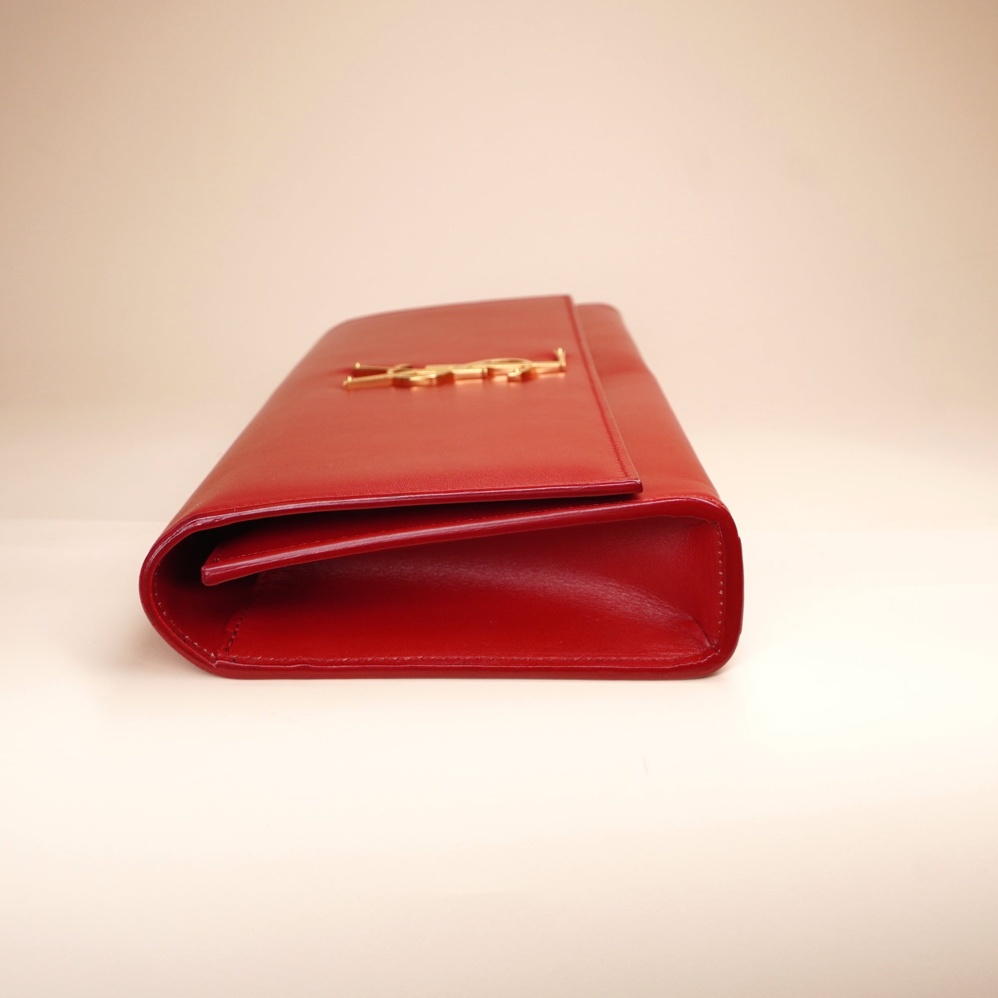 PRE-OWNED Red Leather Cassandre Clutch