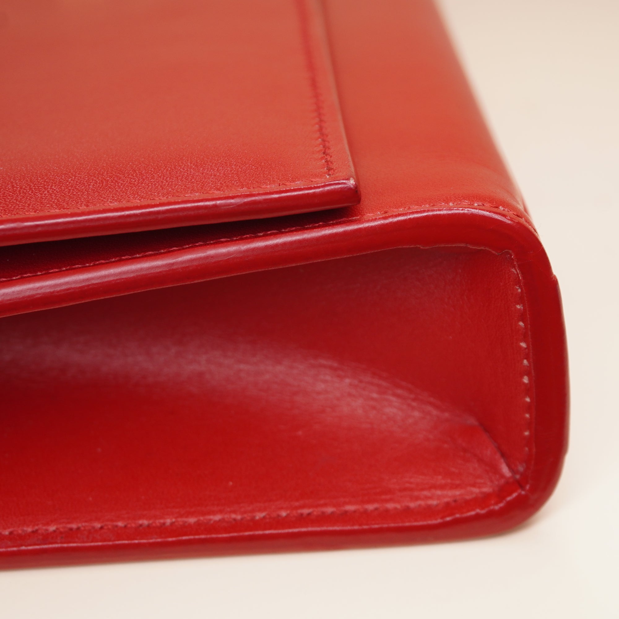 PRE-OWNED Red Leather Cassandre Clutch