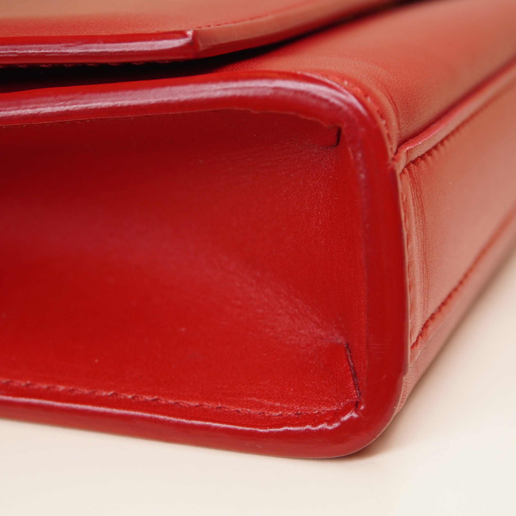 PRE-OWNED Red Leather Cassandre Clutch