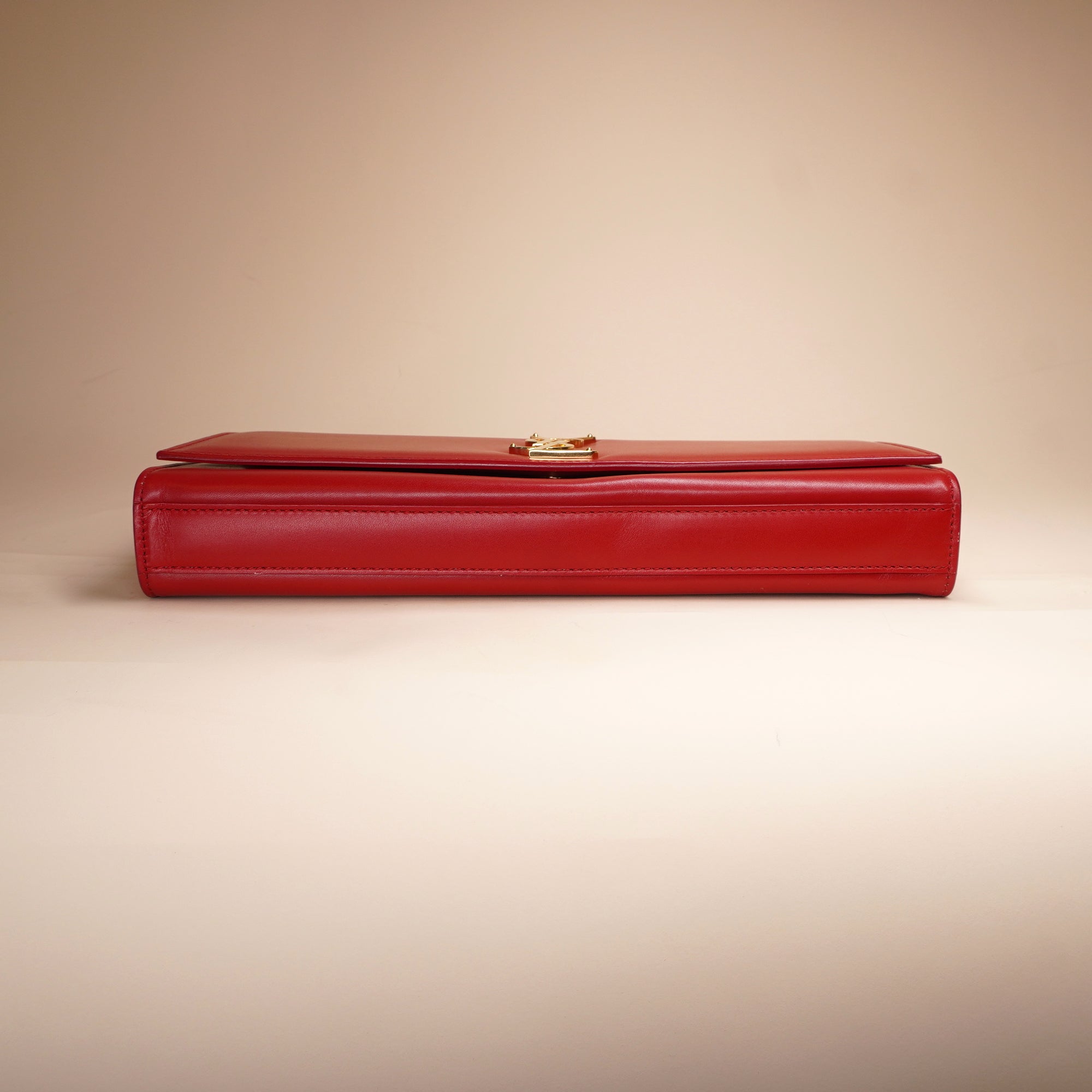 PRE-OWNED Red Leather Cassandre Clutch