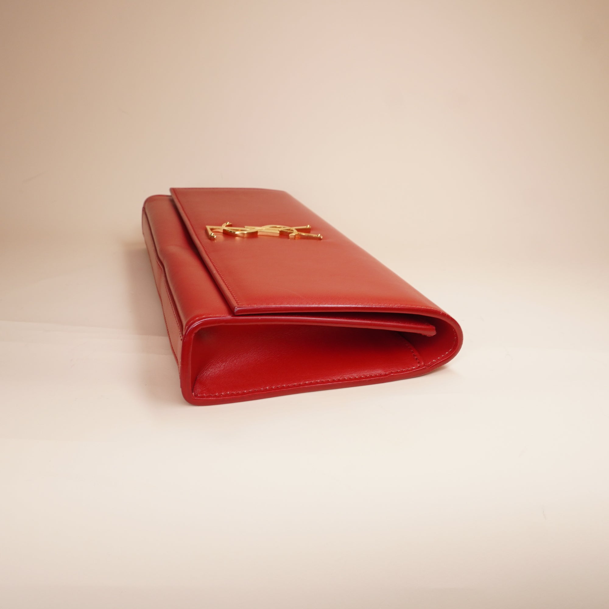 PRE-OWNED Red Leather Cassandre Clutch