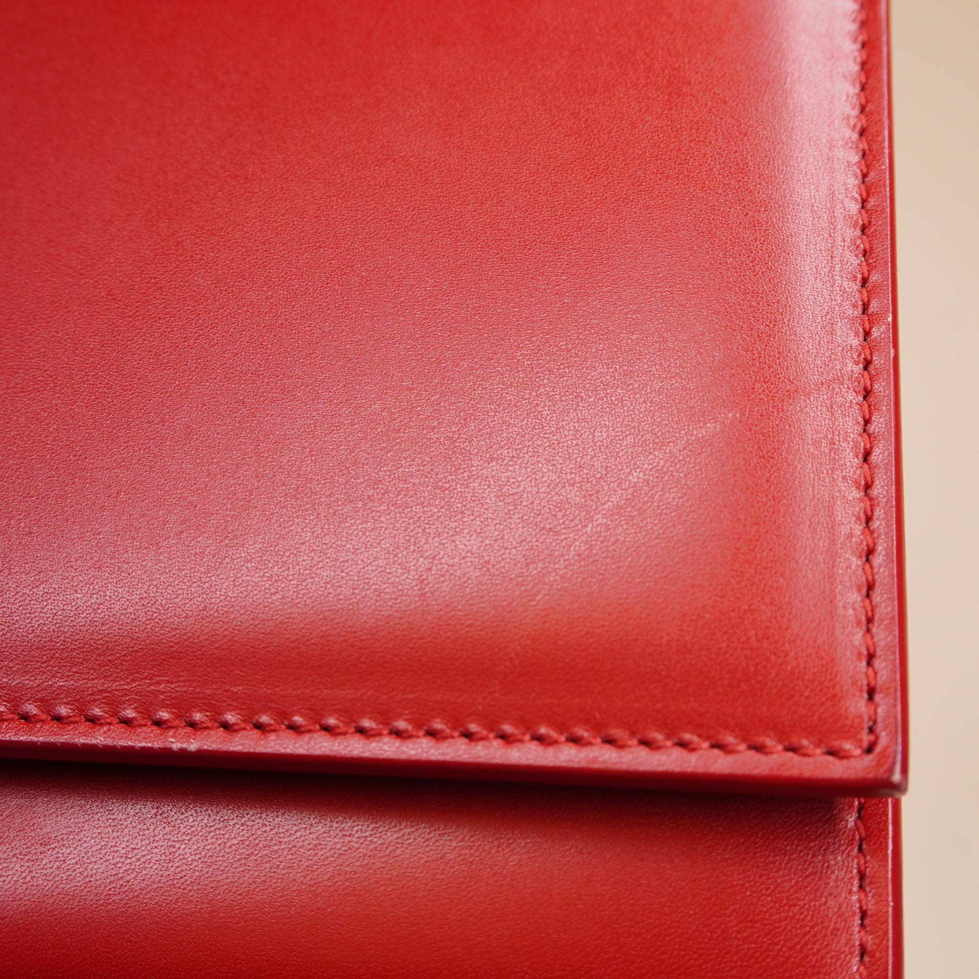 PRE-OWNED Red Leather Cassandre Clutch