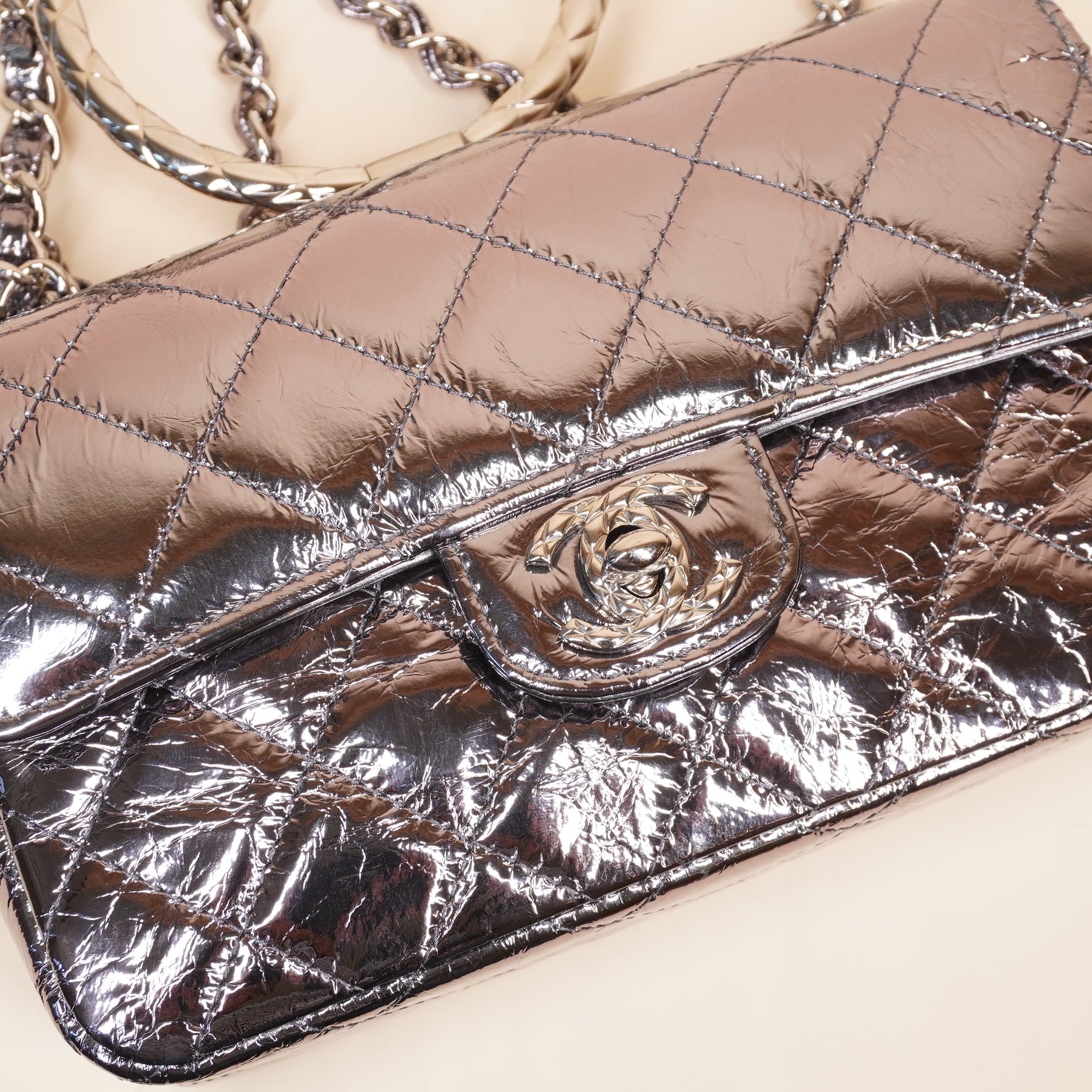 PRE-OWNED CC Quilted Metallic Calfskin Mini Top Handle Flap Bag