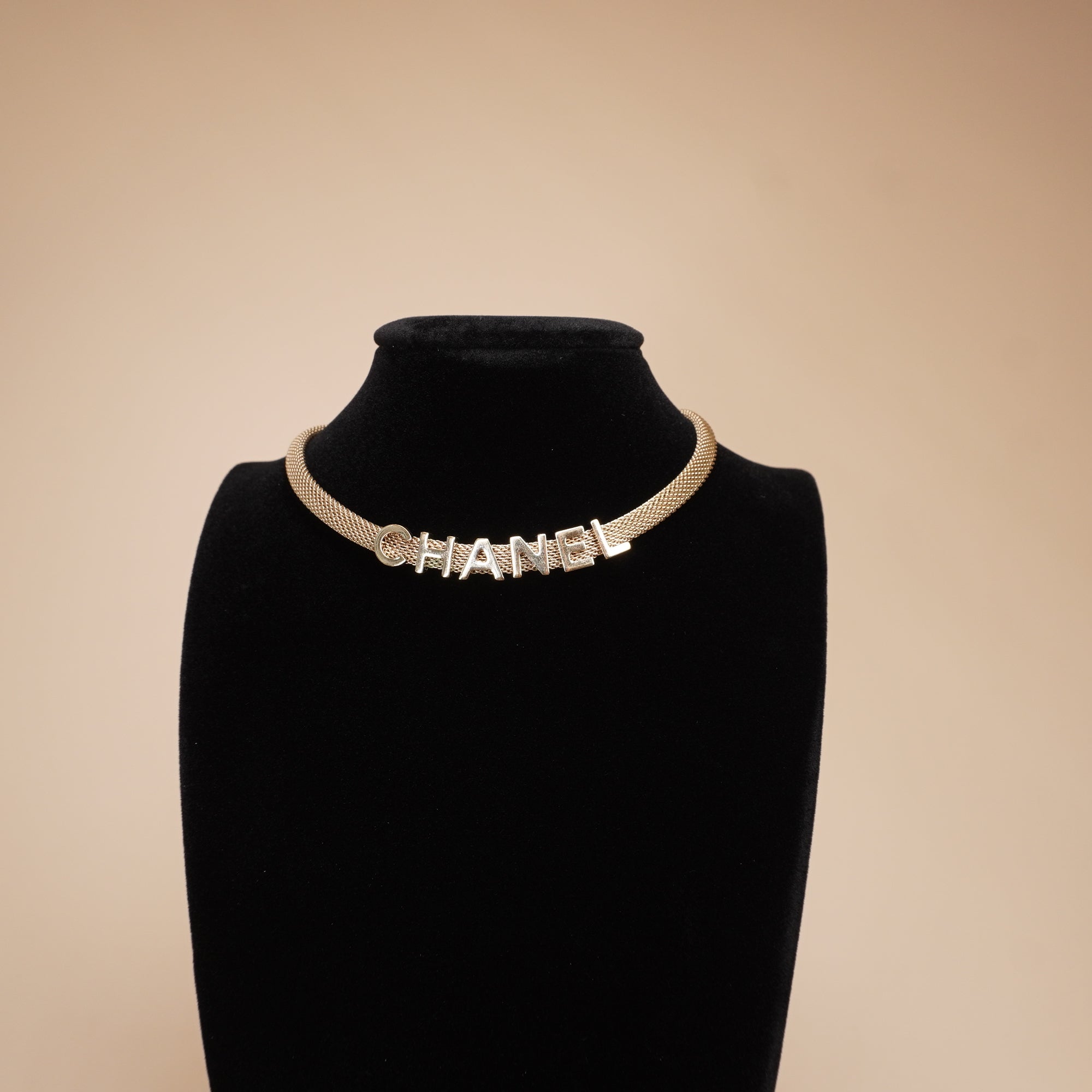 PRE-OWNED CC Gold Tone Logo Mesh Choker Necklace.