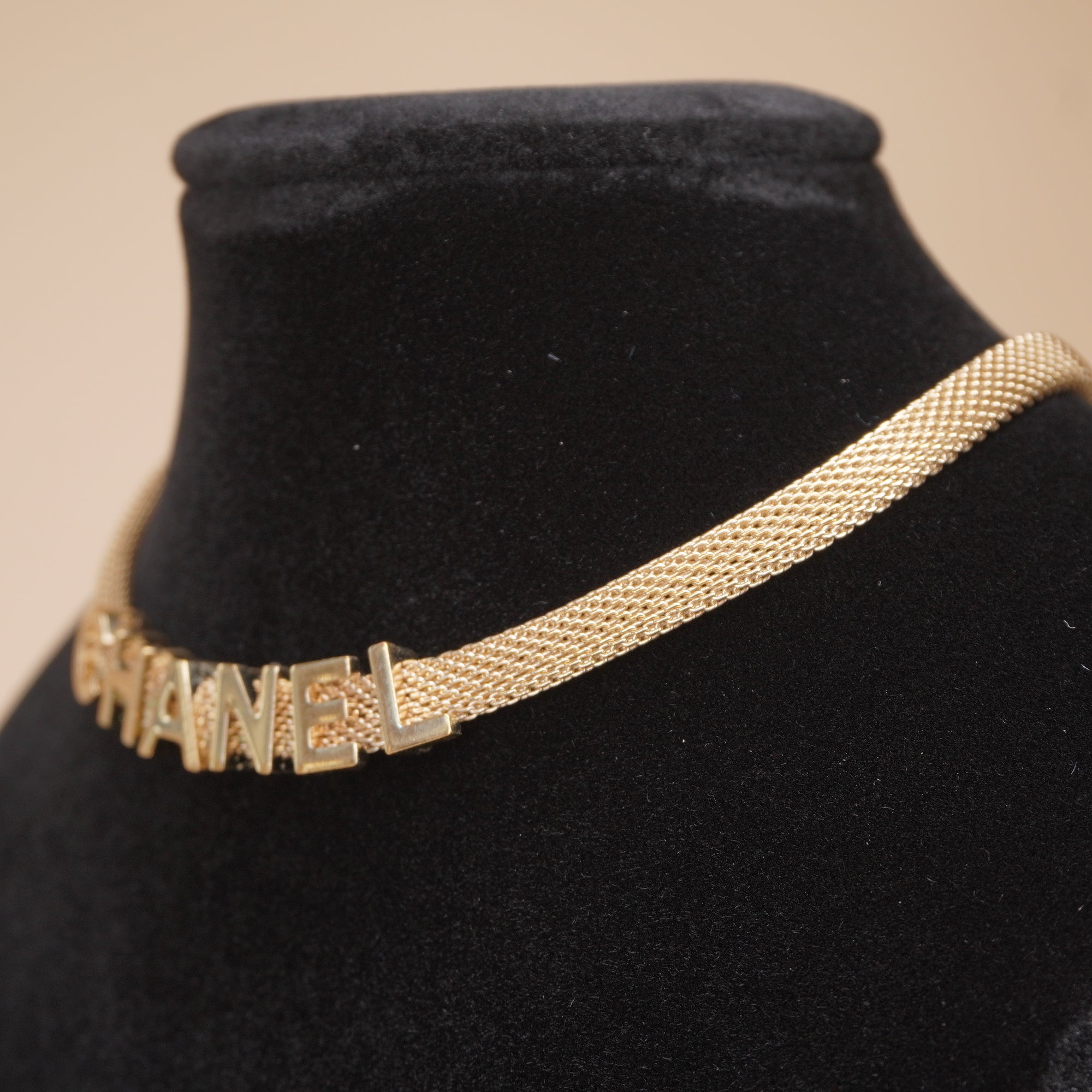 PRE-OWNED CC Gold Tone Logo Mesh Choker Necklace.