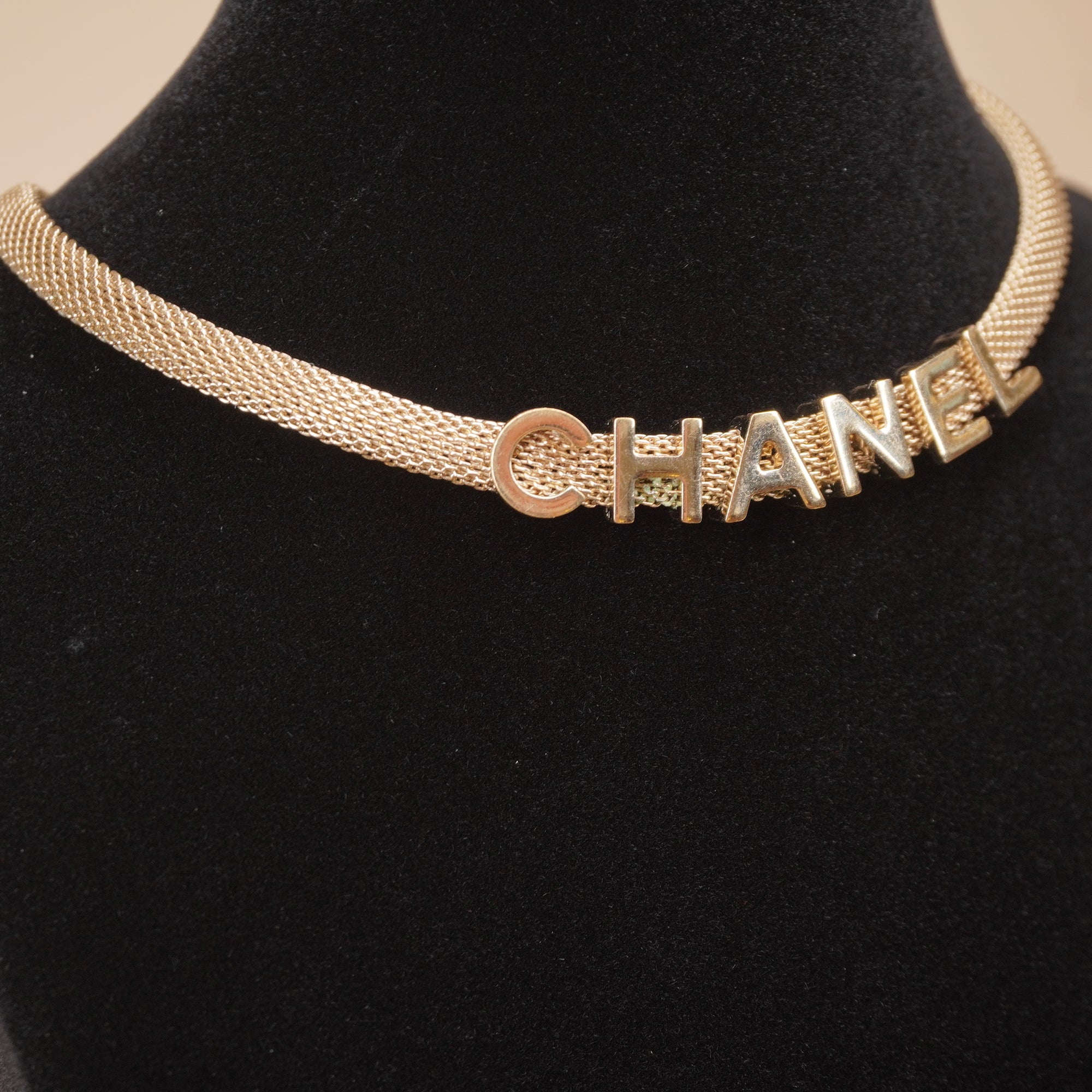 PRE-OWNED CC Gold Tone Logo Mesh Choker Necklace.