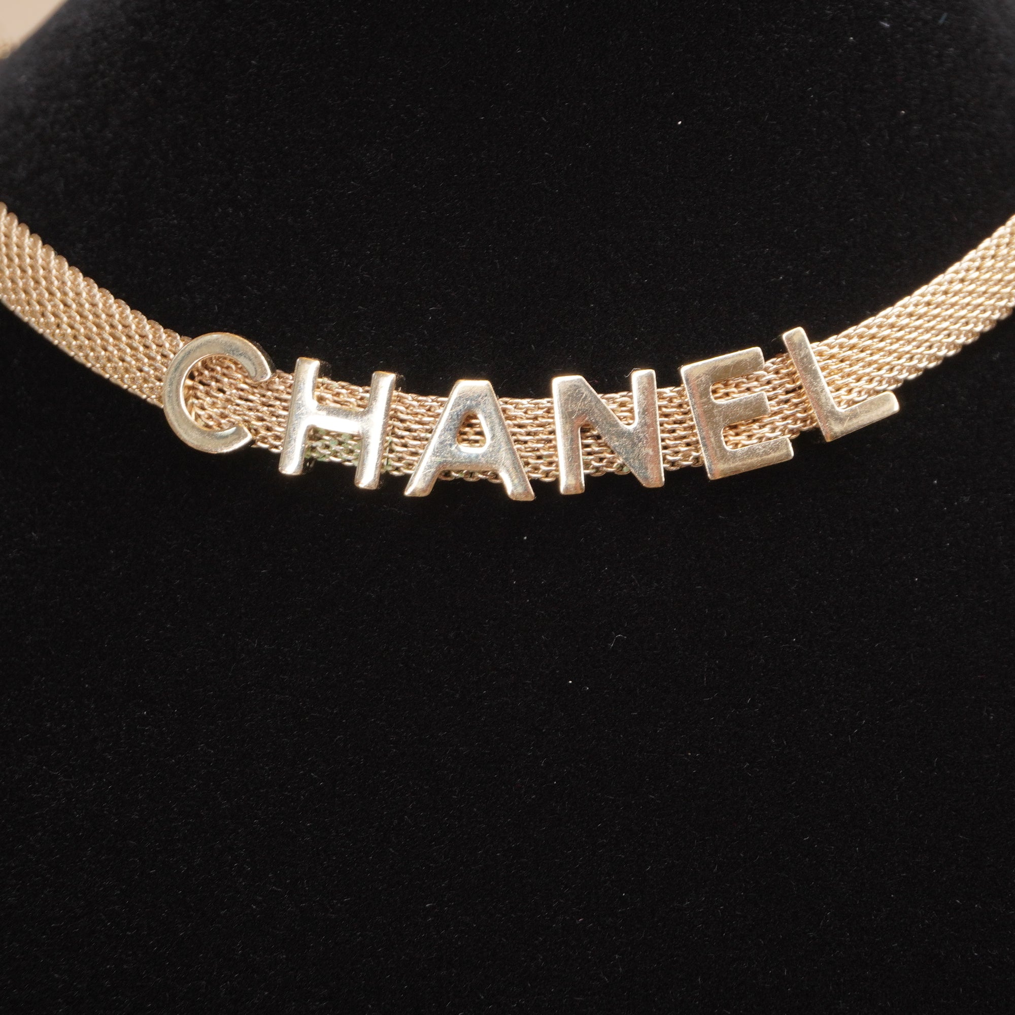 PRE-OWNED CC Gold Tone Logo Mesh Choker Necklace.