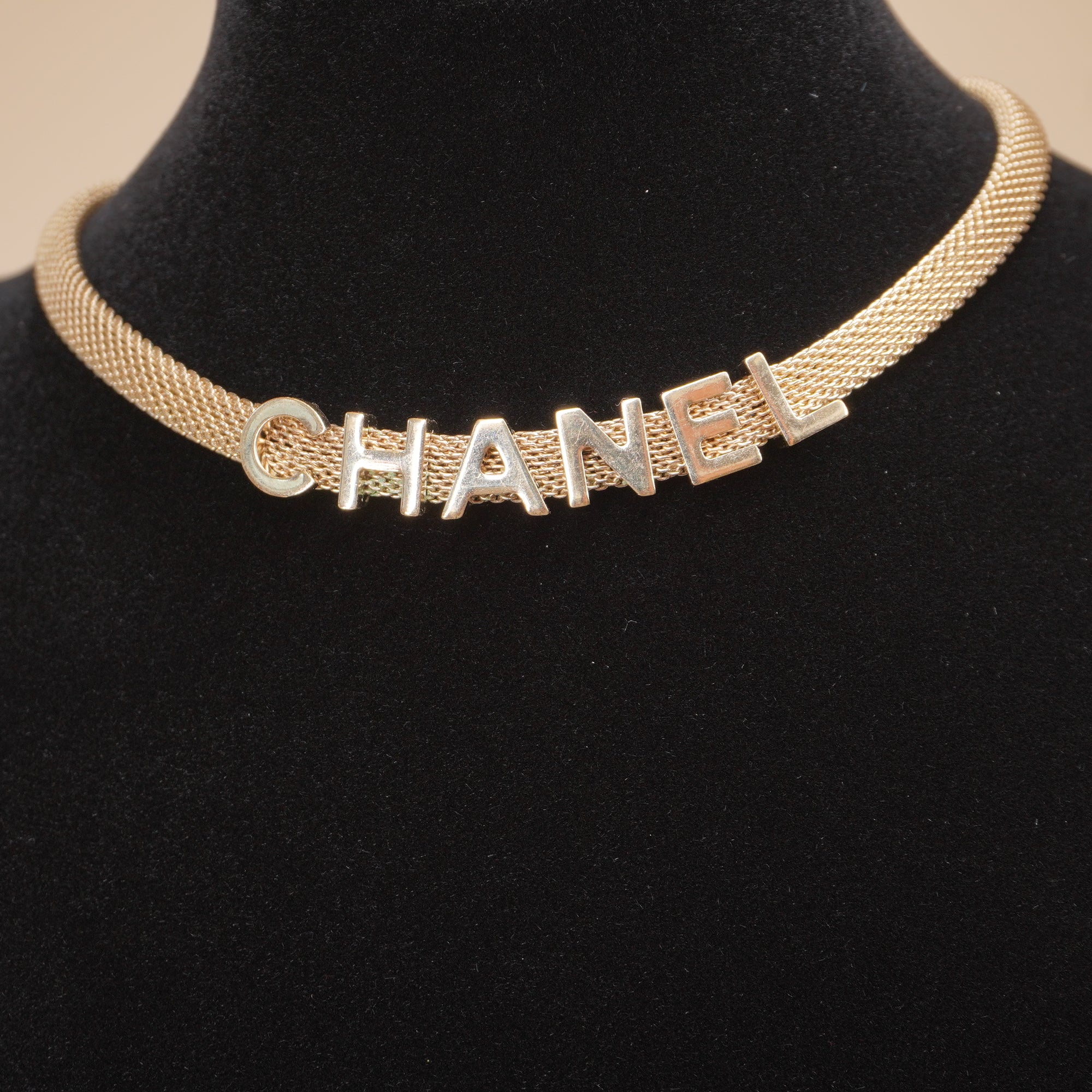 PRE-OWNED CC Gold Tone Logo Mesh Choker Necklace.