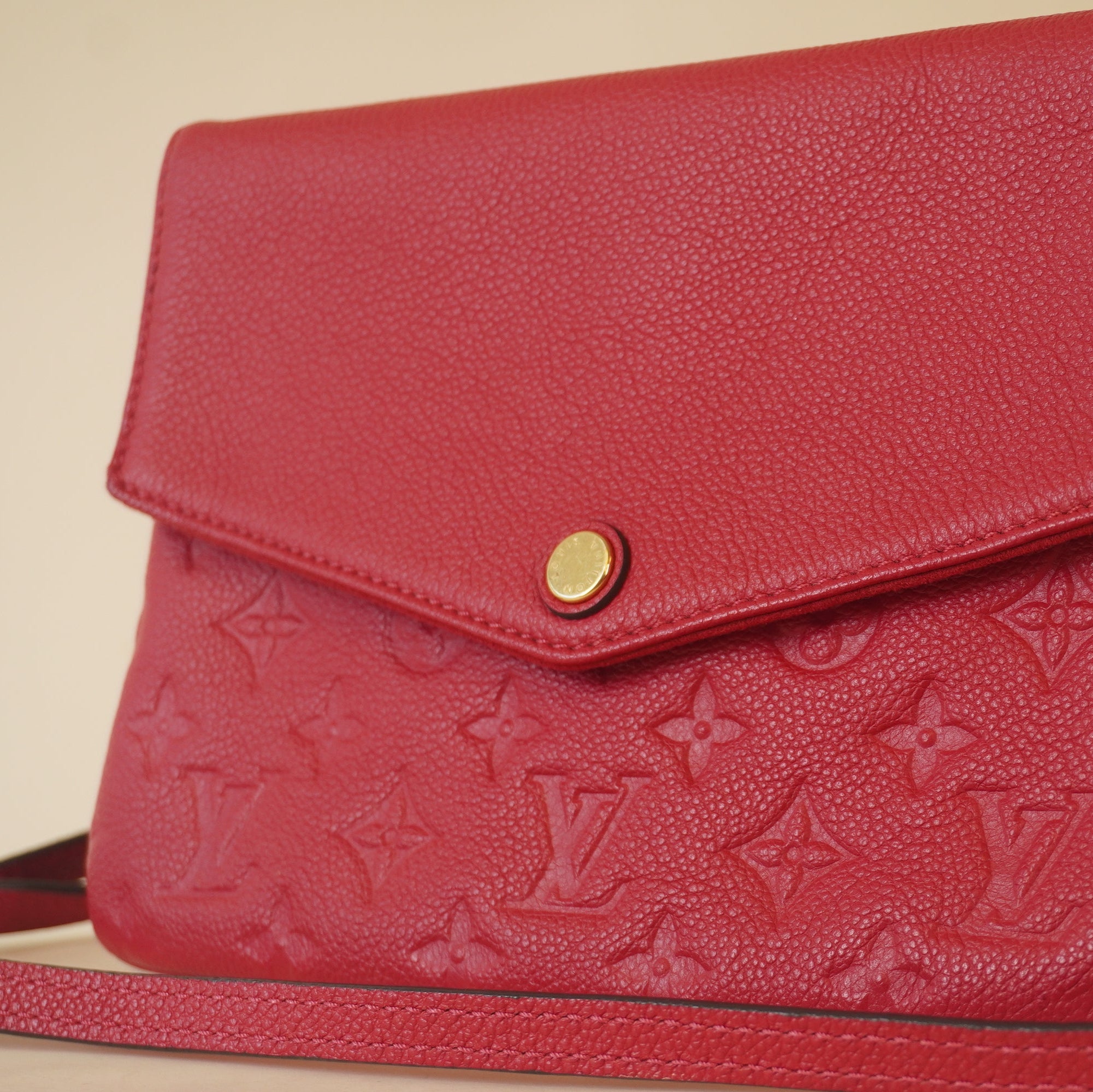 PRE-OWNED LV Raspberry Monogram Empreinte Leather Twice Shoulder Bag