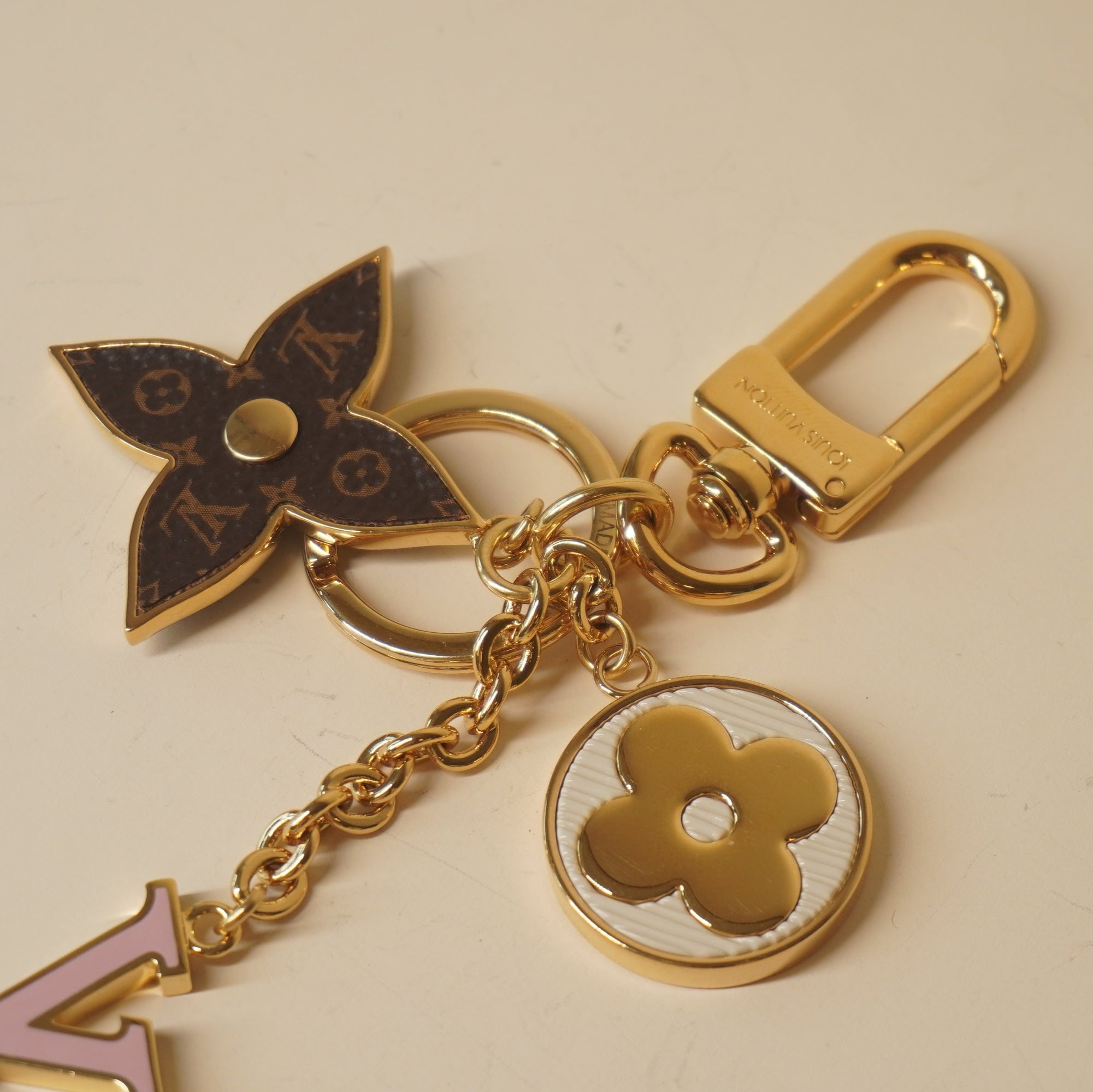 PRE-OWNED LV Metal Monogram Epi Spring Street Bag Charm Key Holder